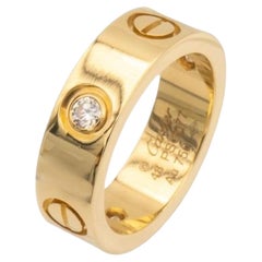 Cartier: 18 Karat Gelbgold Love Ring mit drei Diamanten