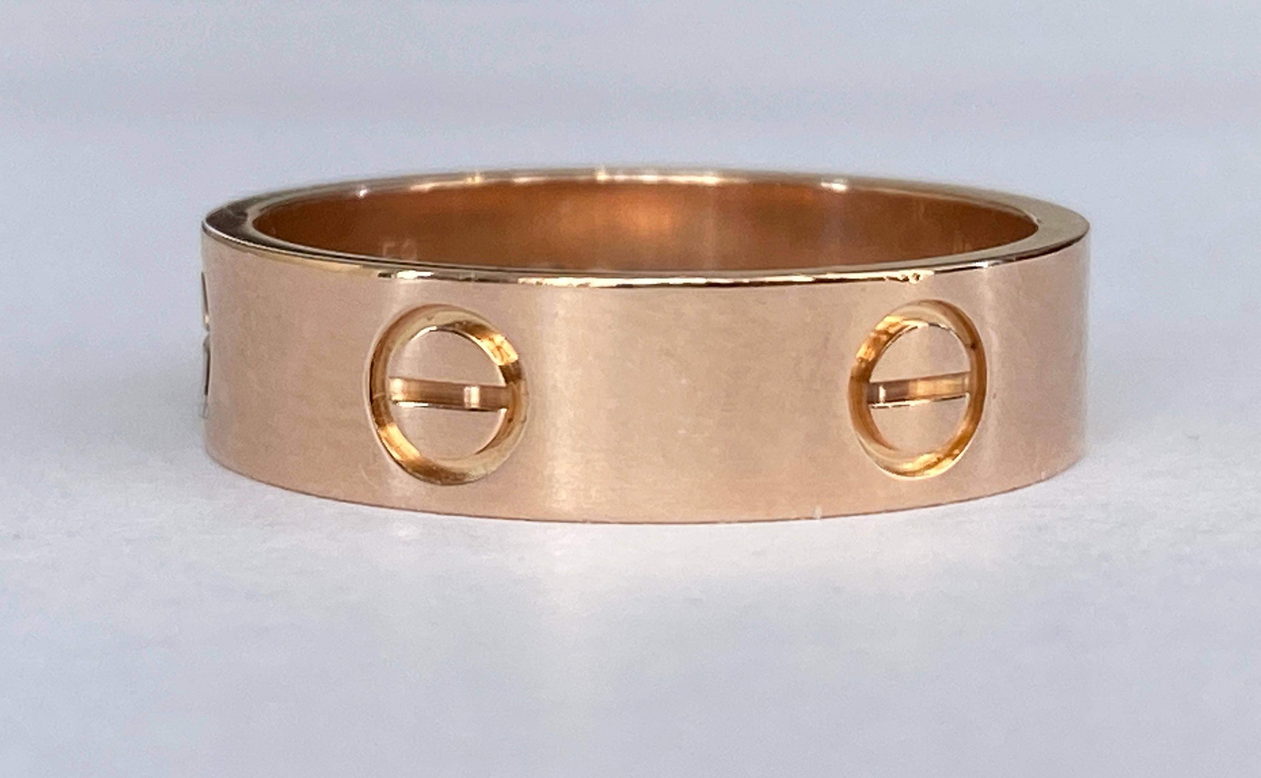 Offered Pink gold Love Cartier ring  in good condition. Hallmarks: signed Cartier, 59, Au750, 750 Swiss hallmark, 750 international convention hallmark. Serial number: DAW792. Ring size: 18.75 mm / 59.  Ring width: 5.50 mm. Weight: 6.4 grams.