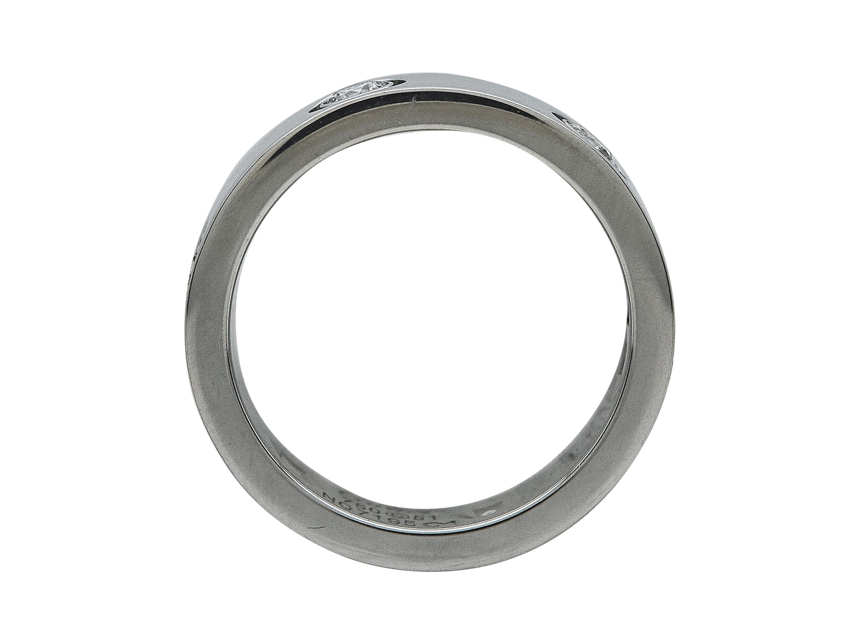 The ring: A Cartier Love ring. This Classic model is designed in eighteen karat white gold, set with six round brilliant-cut diamonds. It is a size 51. 

The ring is in excellent condition, with only a few minor scratches that are expected with