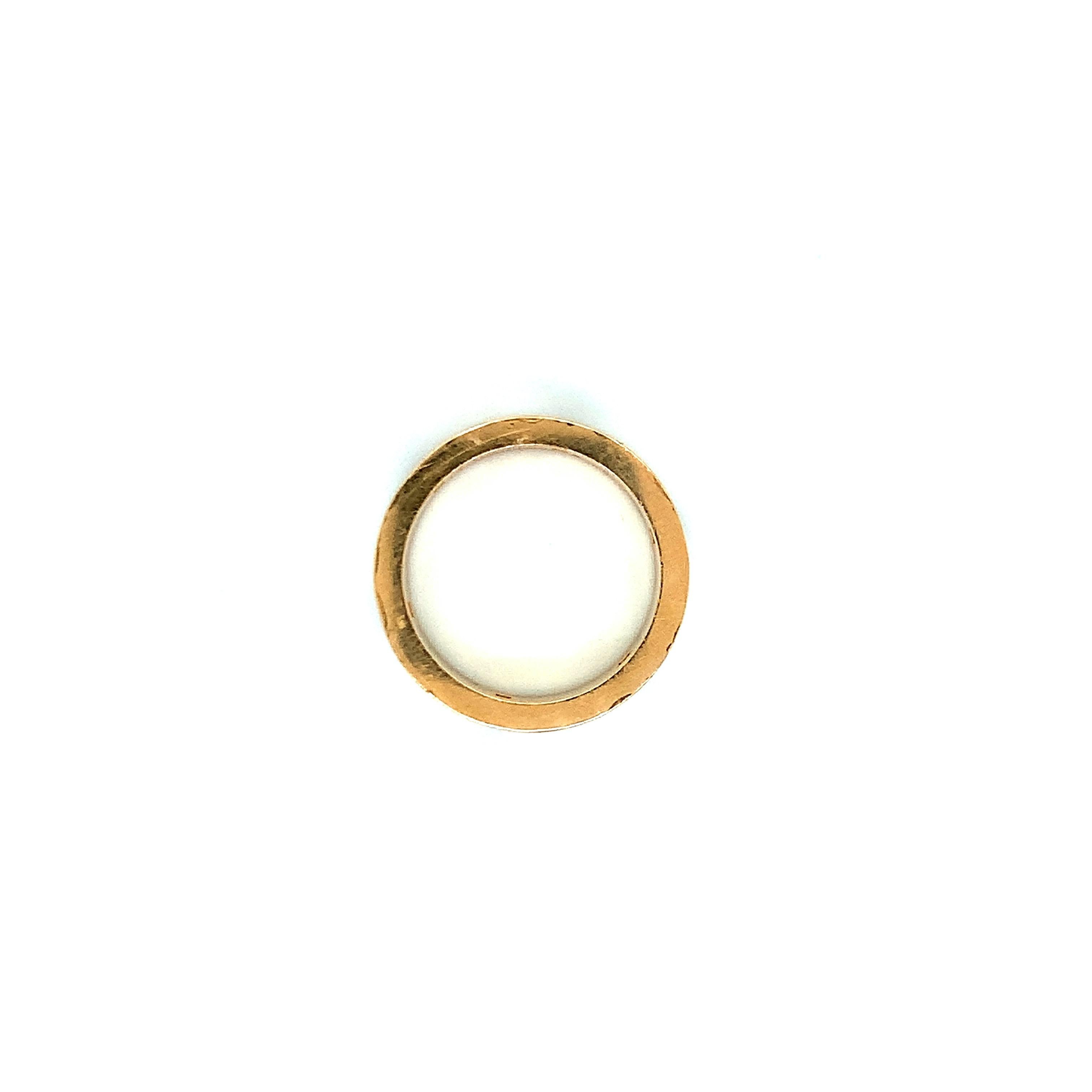 A classic Cartier creation, this 18 karat gold love ring features multiple gemstones found around the band. Total weight: 9.1 grams. Size 6.5-6.75. (European 53). 

Serial No. PF 9811