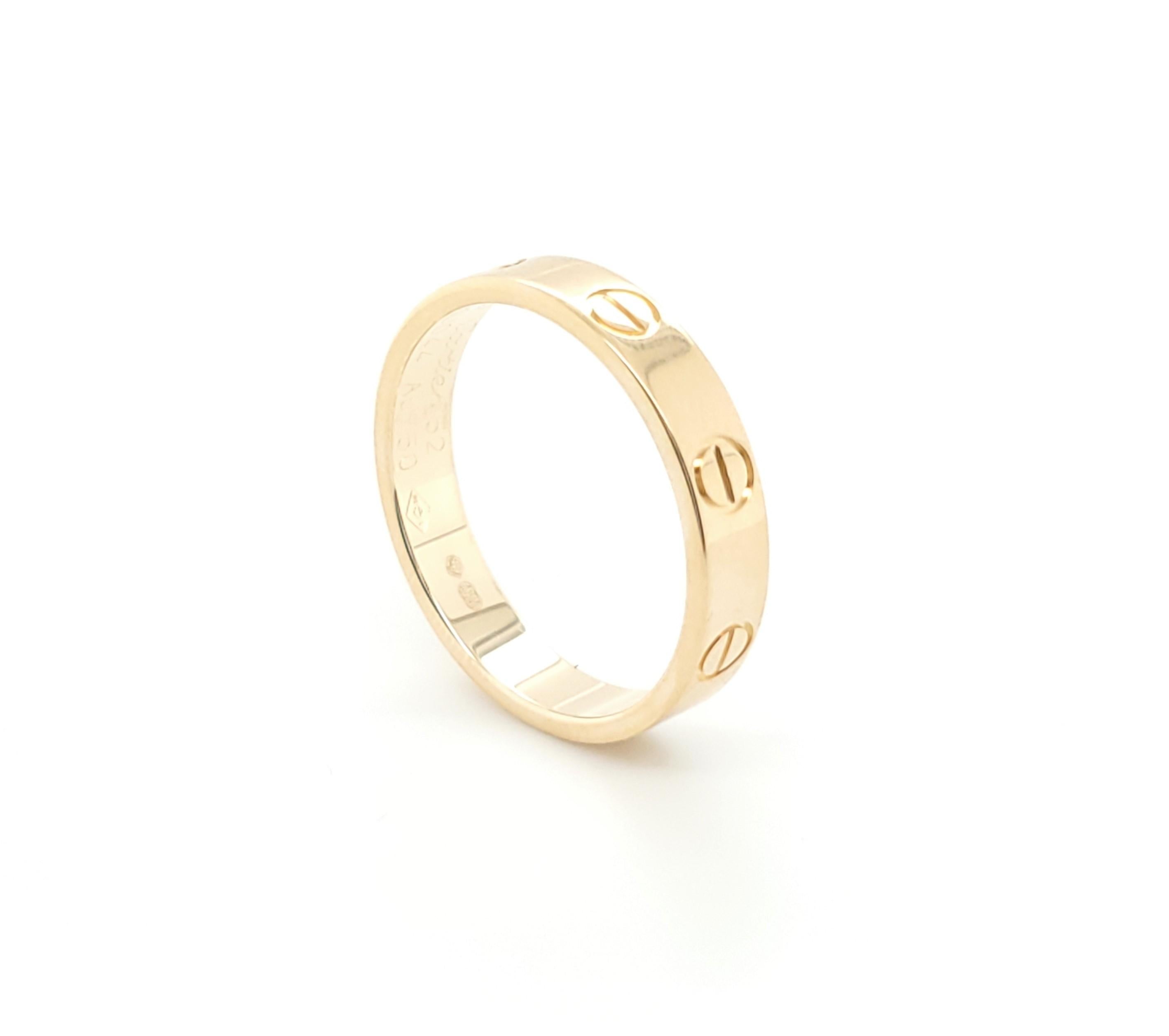 Authentic Cartier Love ring in 18 karat yellow gold.  CIRCA 2018.  Signed Cartier, Au 750.  The ring comes with the Cartier certificate, does not have the original box.  Size 52, US size 6