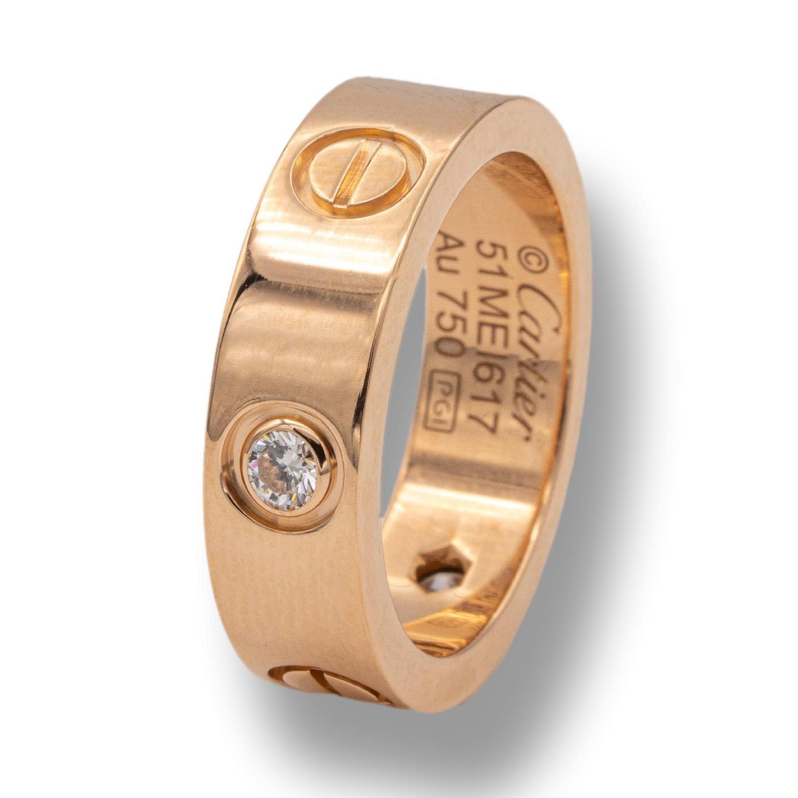 Cartier ring from the LOVE collection finely crafted in 18 karat rose gold with 3 round brilliant cut diamonds weighing 0.22 cts. Includes Certificate of Authenticity. Ring is fully hallmarked.

Brand: Cartier

Hallmarks: © Cartier  51 MEI617

3