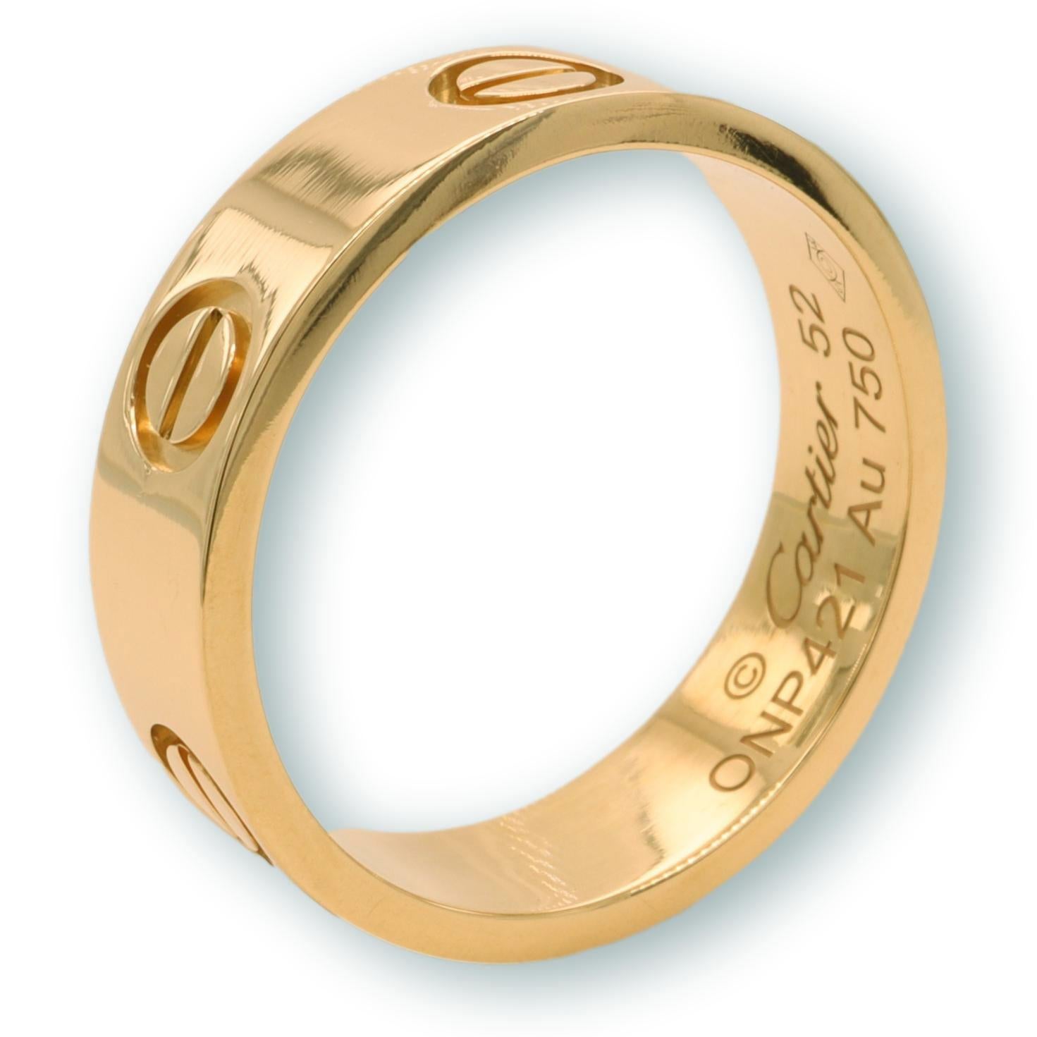 Cartier ring from the LOVE collection finely crafted in 18 karat yellow gold with screw motifs. Measures 5.5 mm wide. Includes Certificate of Authenticity. Ring is fully hallmarked with logo , serial numbers, size and metal content.

Ring