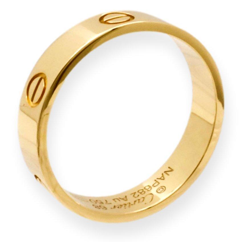 Cartier ring from the LOVE collection finely crafted in 18 karat yellow gold with screw motifs. Measures 5.5 mm wide. Includes Certificate of Authenticity. Ring is fully hallmarked with logo , serial numbers, size and metal content.

Ring