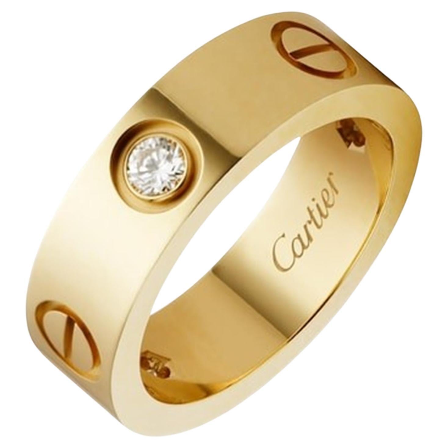 Cartier Love Ring in 18k yellow gold with 3 diamonds with box 
papers en venta