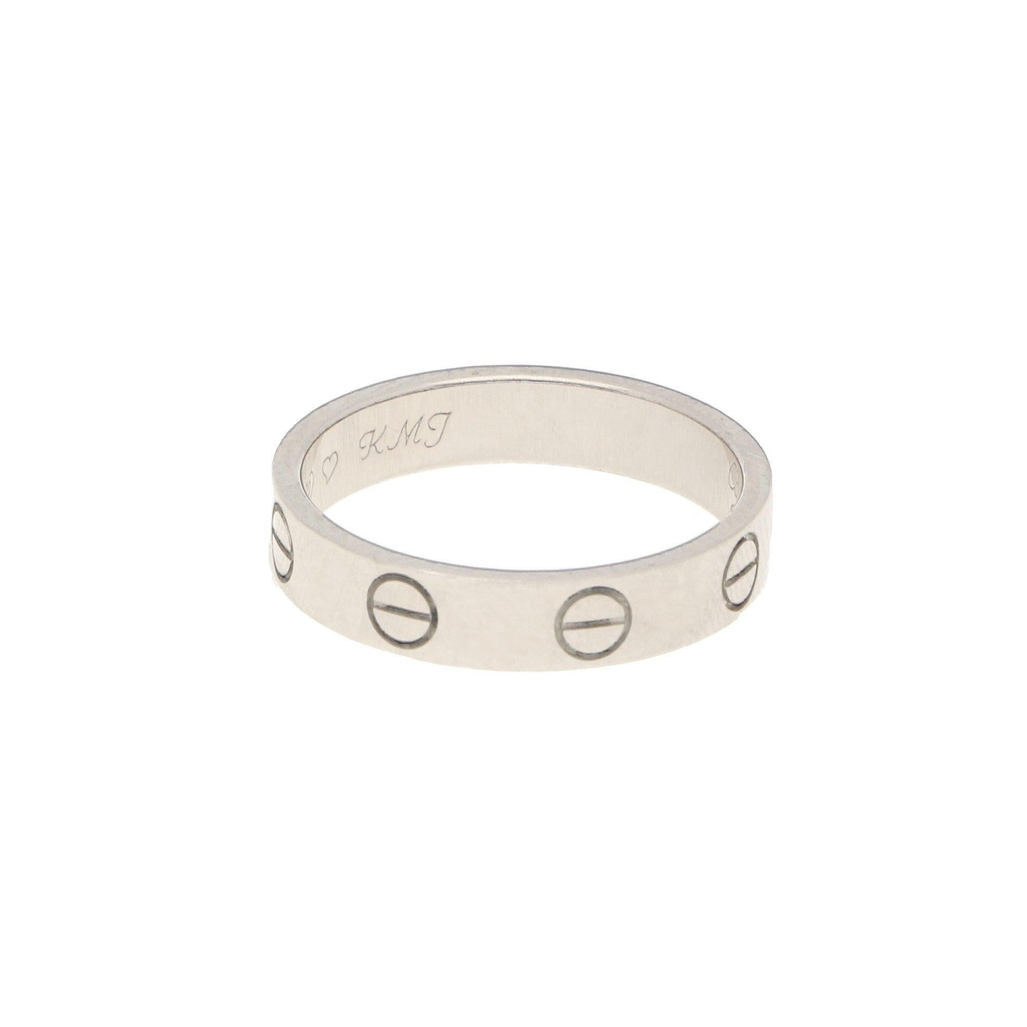 A classic design from Cartier, this 18-karat white gold ring is designed with nail head carvings. 
Signed Cartier, numbered, and accompanied by the original box and outer box. 
This ring is a finger size J, but could be sized to order. 
Dimensions: