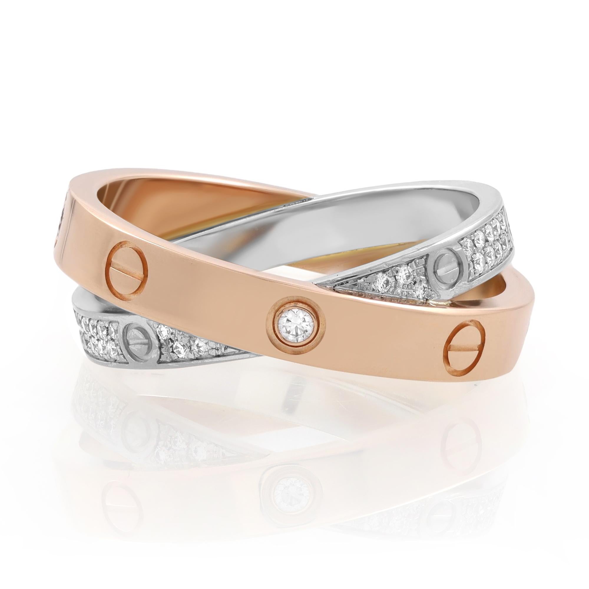 Cartier Love two tone gold pave diamond ring. Crafted in 18K rose gold and 18K white gold. This ring is set with 52 brilliant cut diamonds totaling 0.19 carats. White gold width 2.6mm. Rose gold width 3.5mm. Ring size 52 US 7. Excellent pre-owned