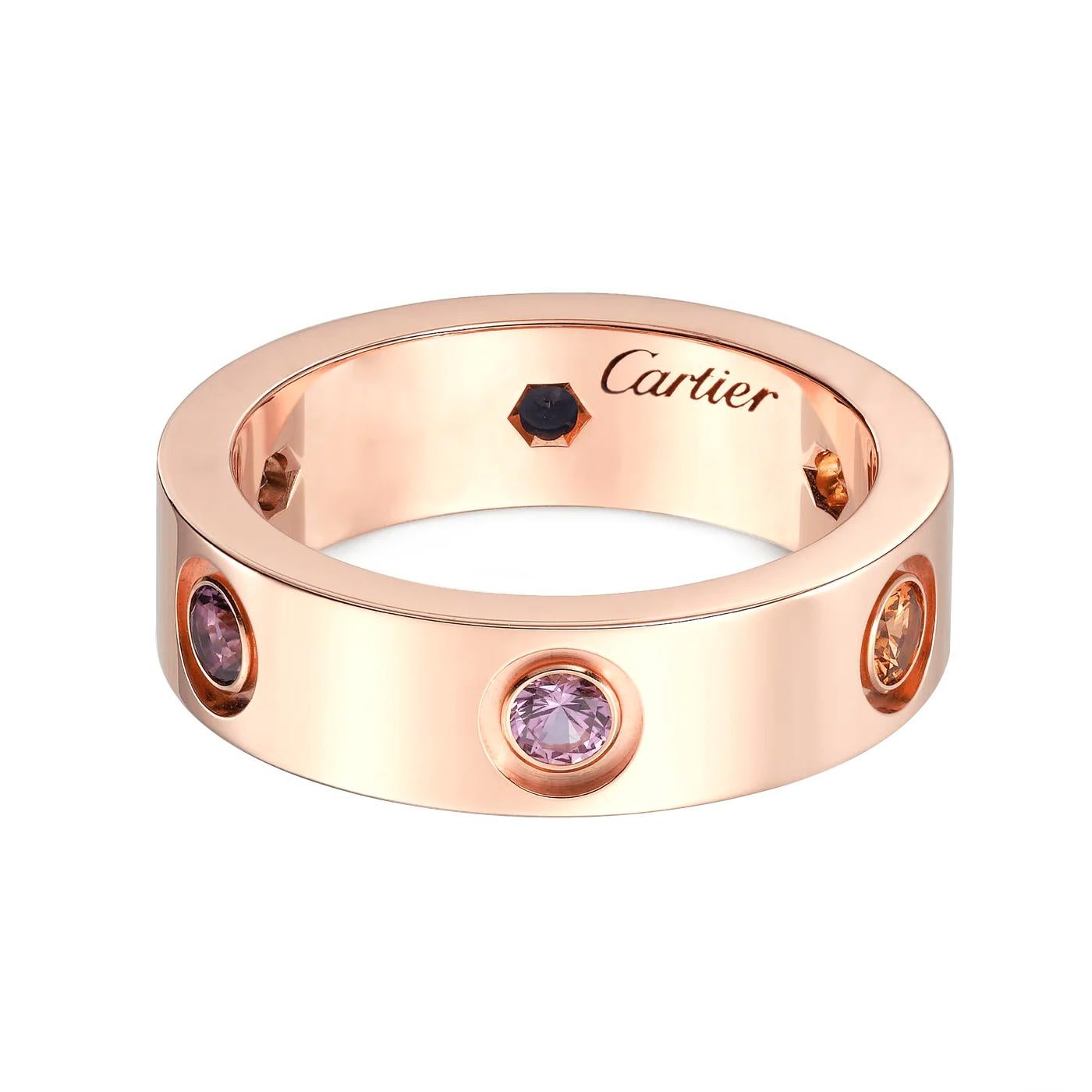 Cartier Love ring, 18K rose gold (750/1000), set with 1 rose sapphire, 1 blue sapphire, 1 yellow sapphire, 1 green garnet, 1 orange garnet, and 1 amethyst. Width: 5.5 mm (for size 52).

Details:
Brand: Cartier
Style: Love Ring
Stone: Sapphires,