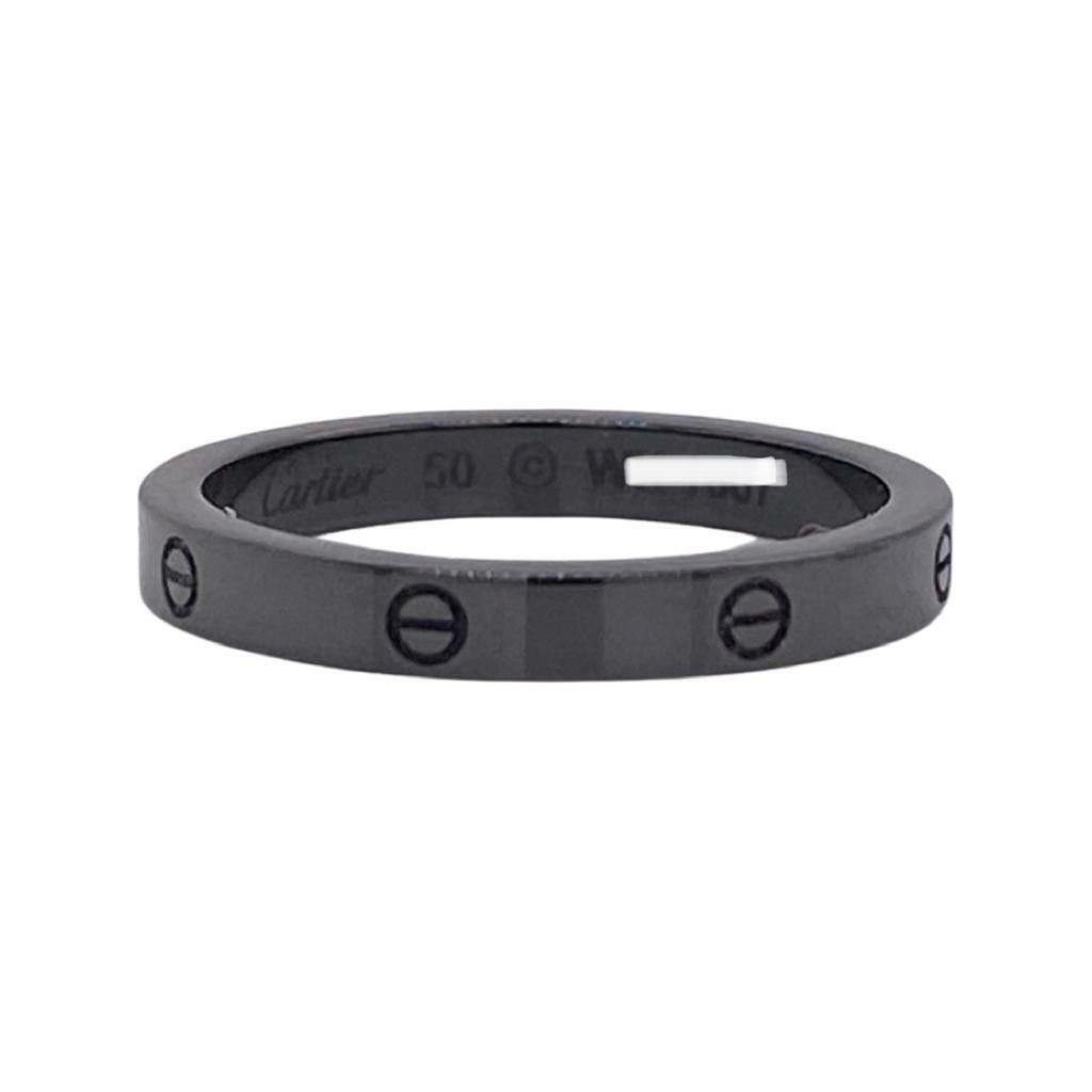Designer: Cartier  
Collection: Love  
Style: Ring  
Metal: White Gold, Black Ceramic  
Metal Purity: 18k  
Band Width: 3.5 mm  
Total Item Weight (Grams): approx. 35.7 g  
Size: 50 EURO ; 5.5 US  
Hallmarks: Cartier; Serial #; 50  
Includes: 24
