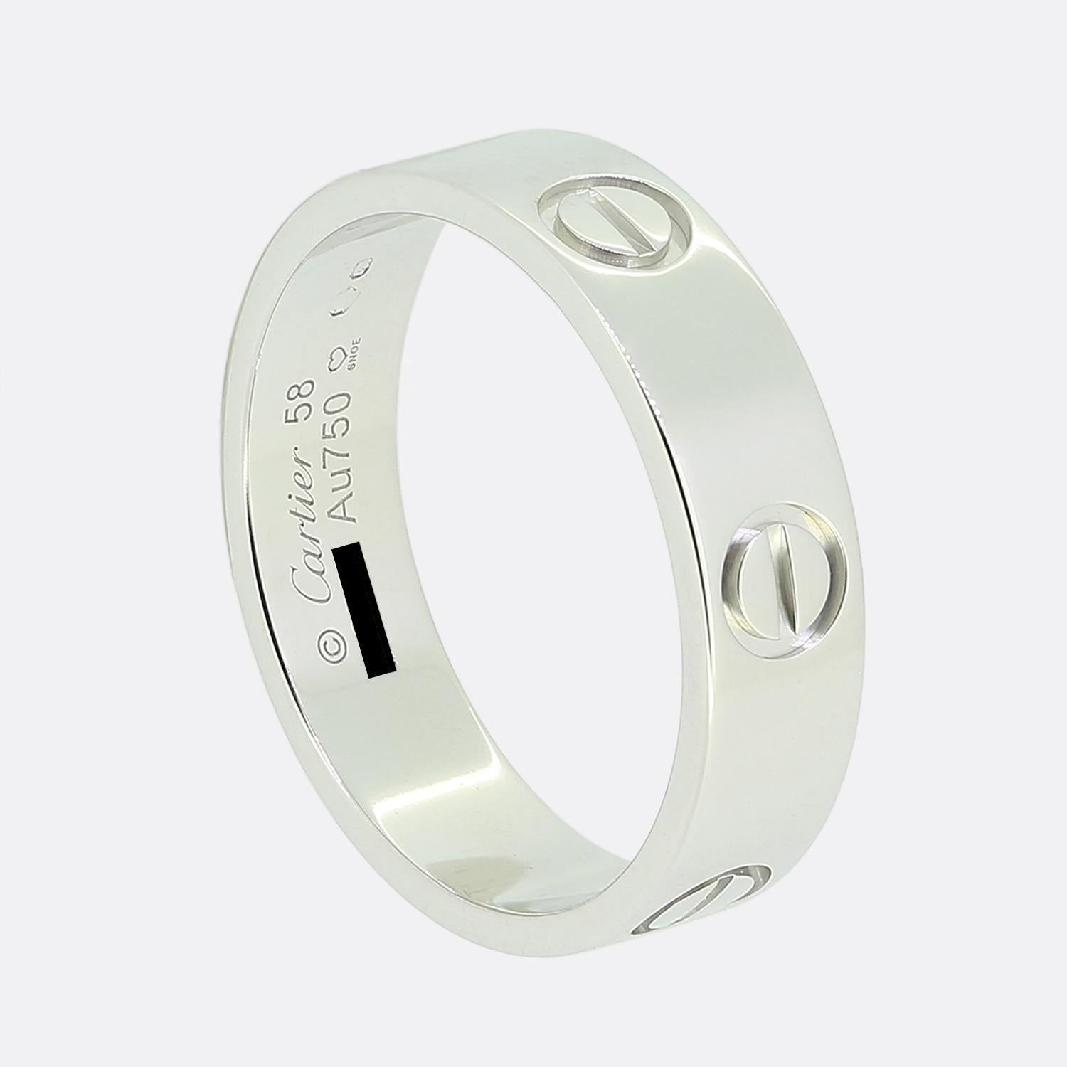 Here we have an 18ct white gold ring from the world renowned luxury jewellery house of Cartier. This ring forms part of their LOVE collection and showcases the iconic screw motif around the entire outer edge. This is the classic model with a width