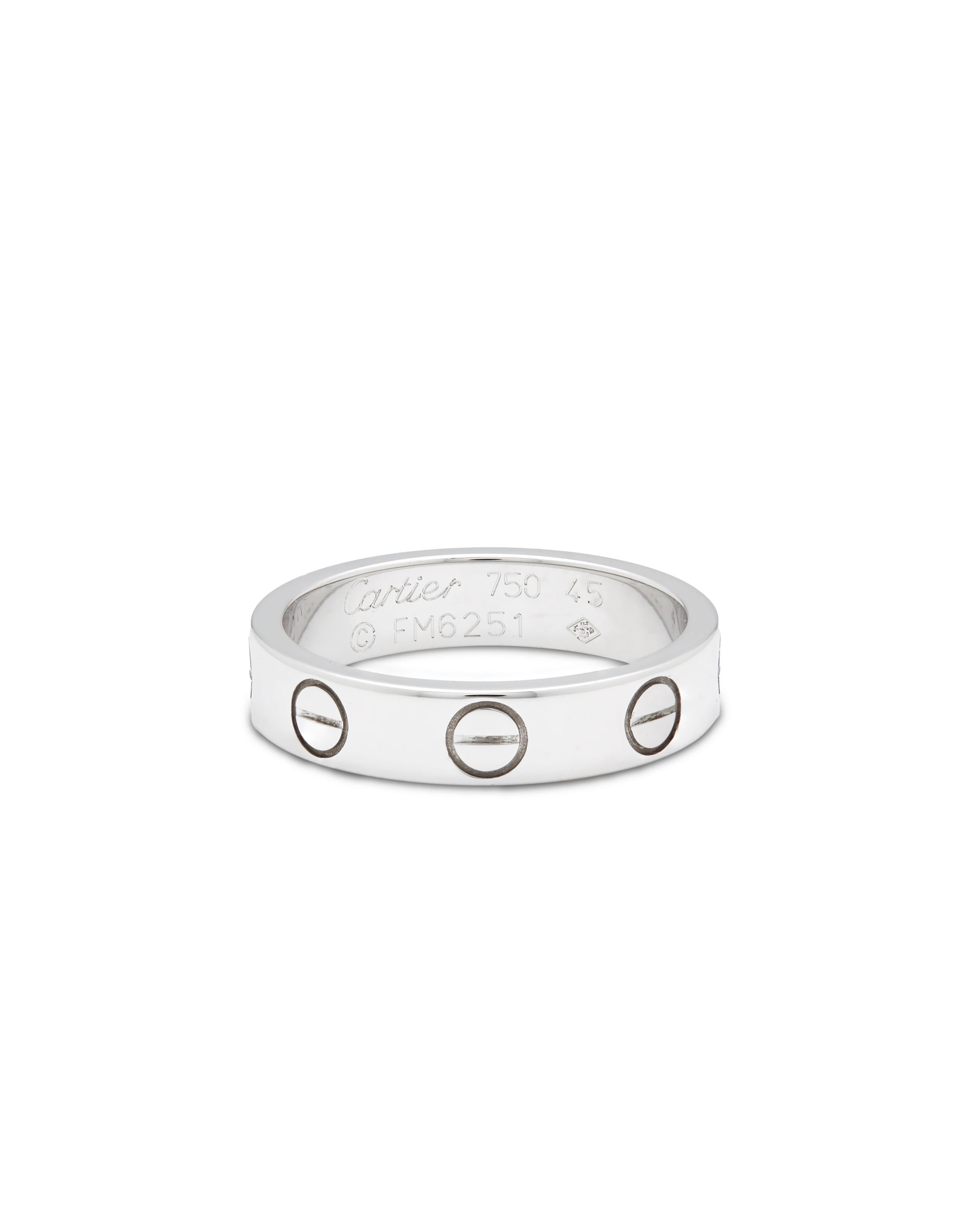 Cartier’s Iconic Love ring.

A symbol of inspired Love, and a must have for a discerning jewellery buyer. Perfect Gift to open in that beautiful red iconic box.  

Signed Cartier:
Stamped with makers marks 
Model number: B4085152
Stamped
