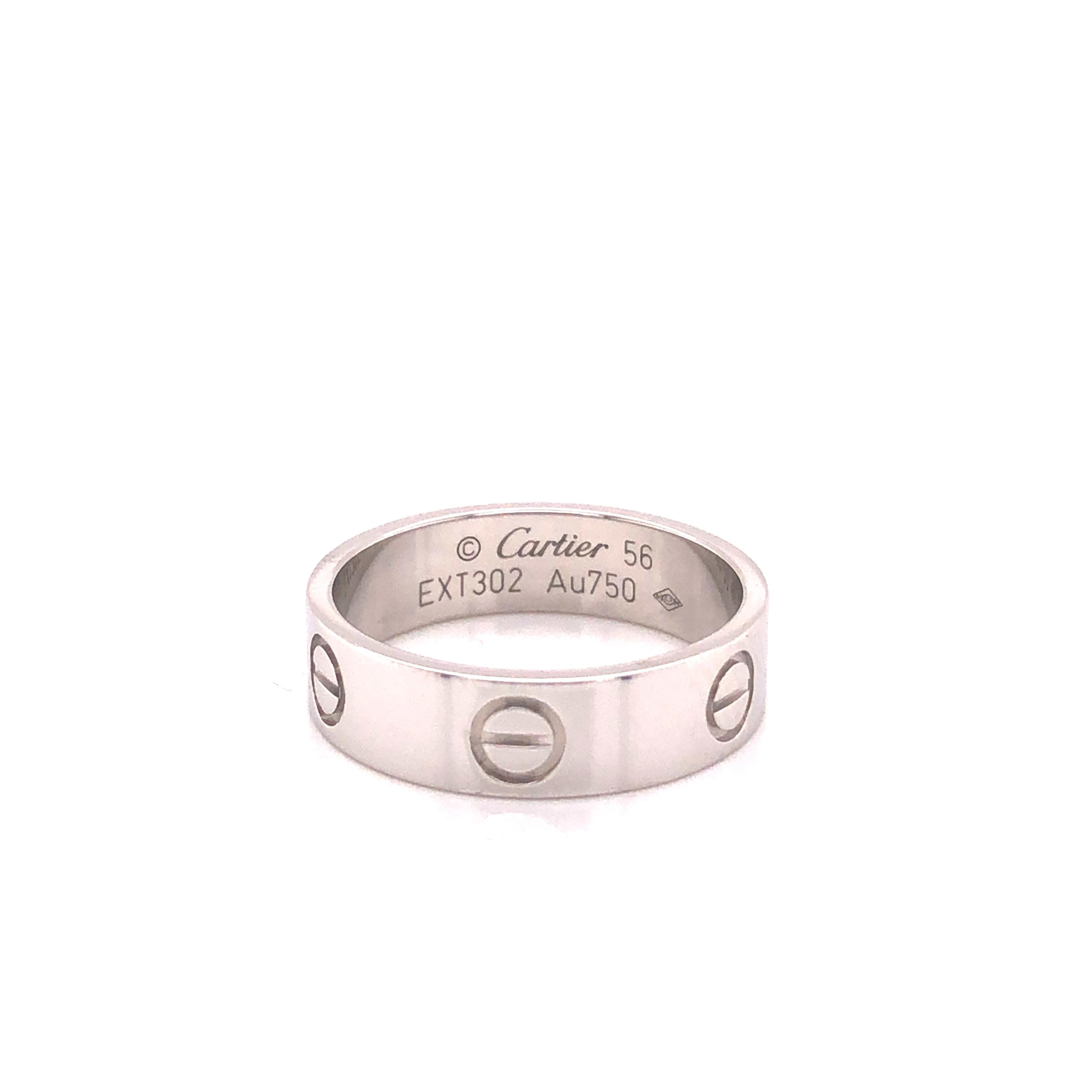 Cartier Love ring in 18K white gold. The ring is a size 56 U.S. size 7.5 with serial EXT---. Ring is fully hallmarked by designer 