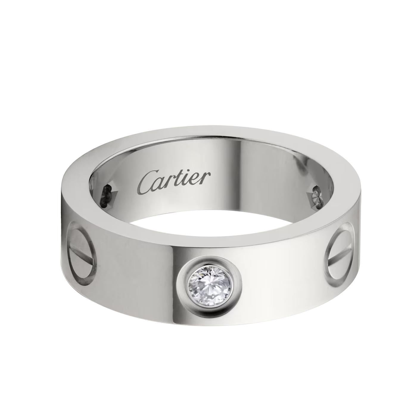 LOVE ring, white gold (750/1000), set with 3 brilliant-cut diamonds totaling 0.22 carats. Width: 5.5 mm (for size 60).

Details:
Brand: Cartier
Style: Love Ring
Carat Weight: 0.22 Carats
Stone: 3 Brilliant-Cut Diamonds 
Material: White Gold
Size: