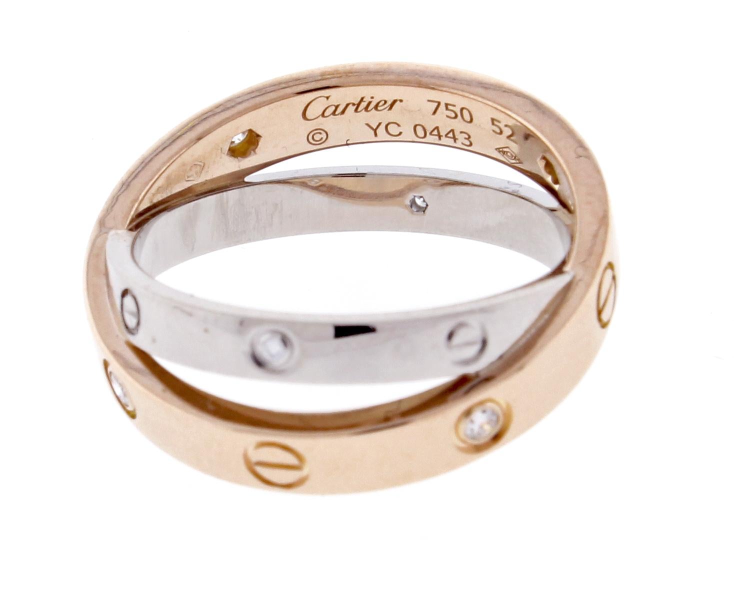 Love ring, 18 Karat pink gold, 18 karat white gold, set with 6 brilliant-cut diamonds totaling 0.07 carat. Size 52  US6,  As new condition