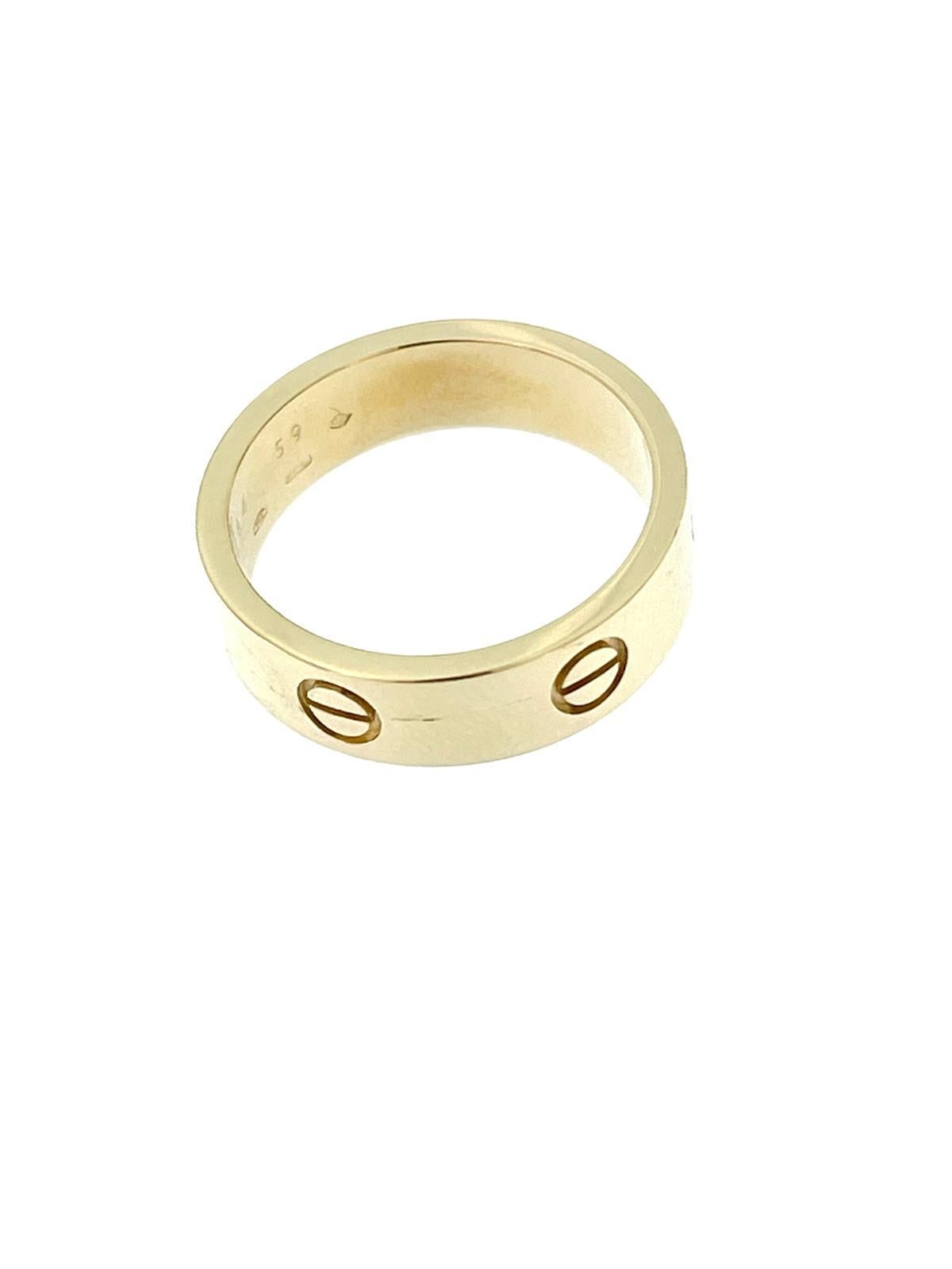 The Cartier Love Ring in Yellow Gold is a luxurious and iconic piece of jewelry created by the renowned French jewelry and watchmaker, Cartier. 

The ring is crafted from 18-karat yellow gold, which is known for its rich and warm color, as well as