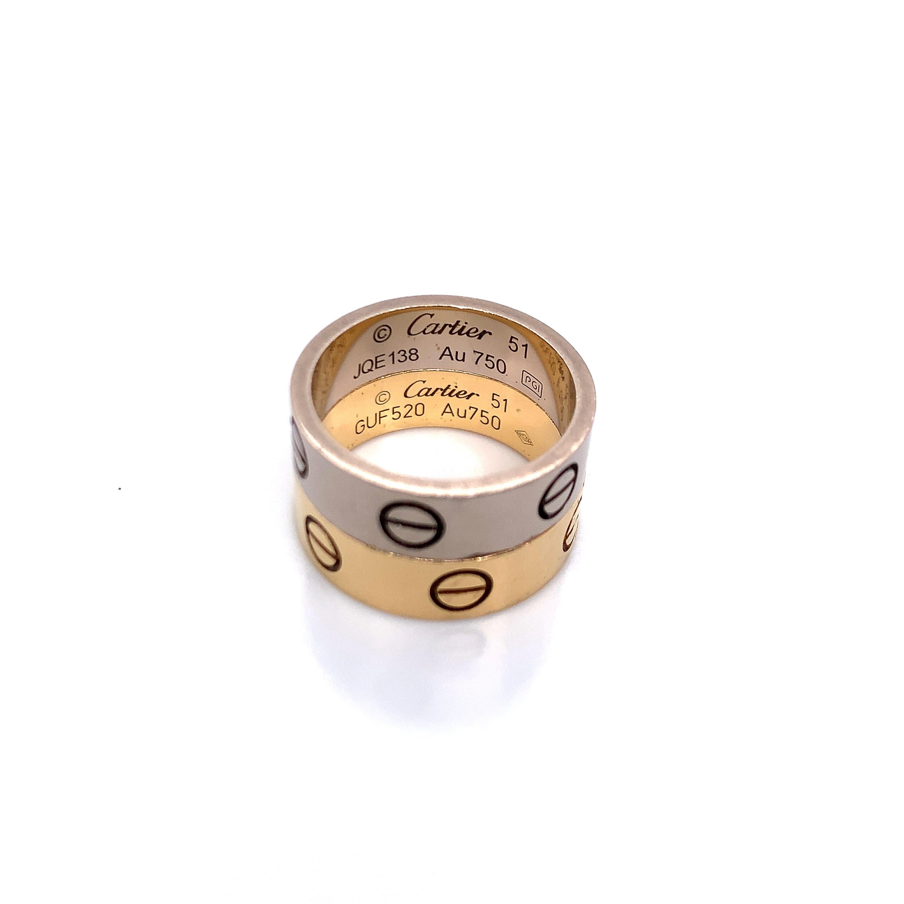 A set of two 18k Cartier Love rings (yellow gold and white gold) (750/1000). Together, they weigh 12.0 grams in size 51 (approximately 5.75 in US).

Serial Nos. GUF520 & JQE138
