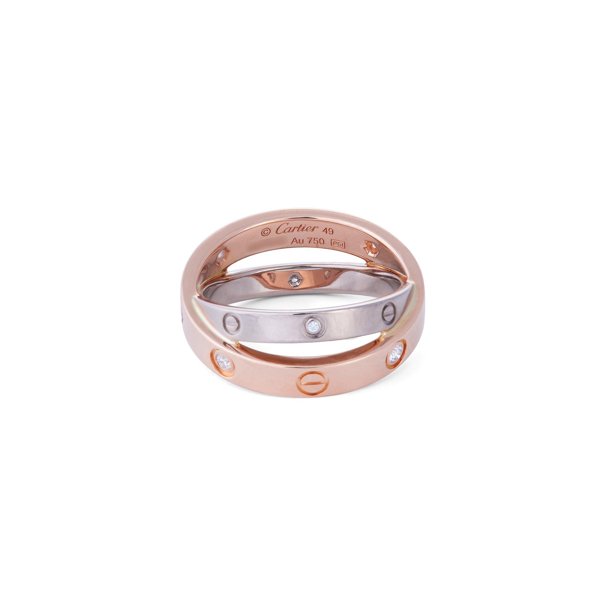 Authentic Cartier Love ring crafted in 18 karat rose and white gold. Set with 6 round cut diamonds weighing an estimated .07 carats total. The rose gold band measures 3.5mm and crosses over a slightly thinner white gold band, measuring 2.6mm. Signed