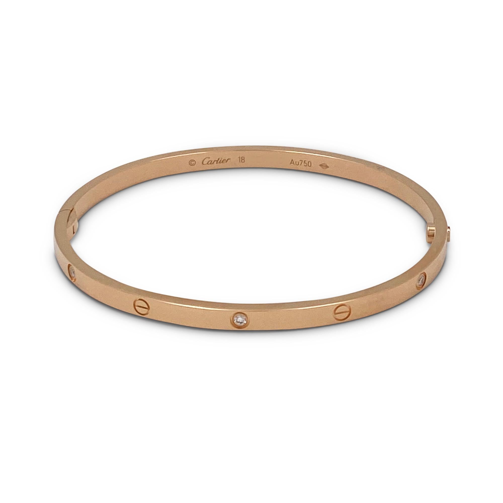 Das authentische Armband 'Love' von Cartier aus 18 Karat Roségold ist mit sechs runden Diamanten im Brillantschliff (E-F:: VS) von insgesamt 0::15 Karat besetzt. Größe 18:: 3::65 mm breit.  Signiert Cartier:: Au750:: 18:: mit Seriennummer und Punze.