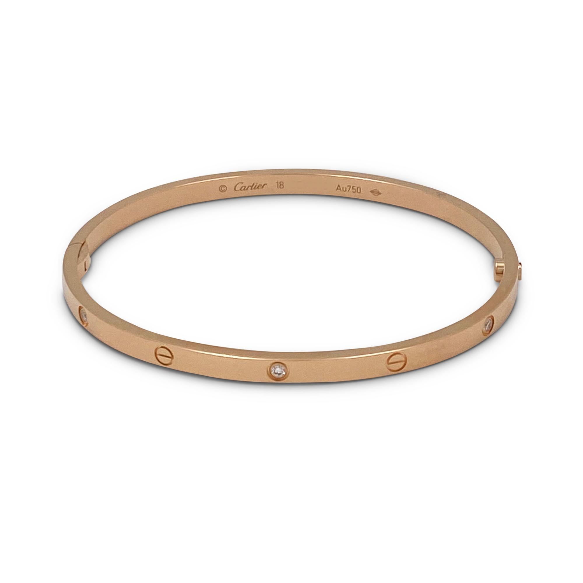 Authentic Cartier 'Love' bracelet crafted in 18 karat rose gold is set with six round brilliant cut diamonds (E-F, VS) weighing 0.15 carats total. Size 18, 3.65 mm wide.  Signed Cartier, Au750, 18, with serial number and hallmark. The bracelet is