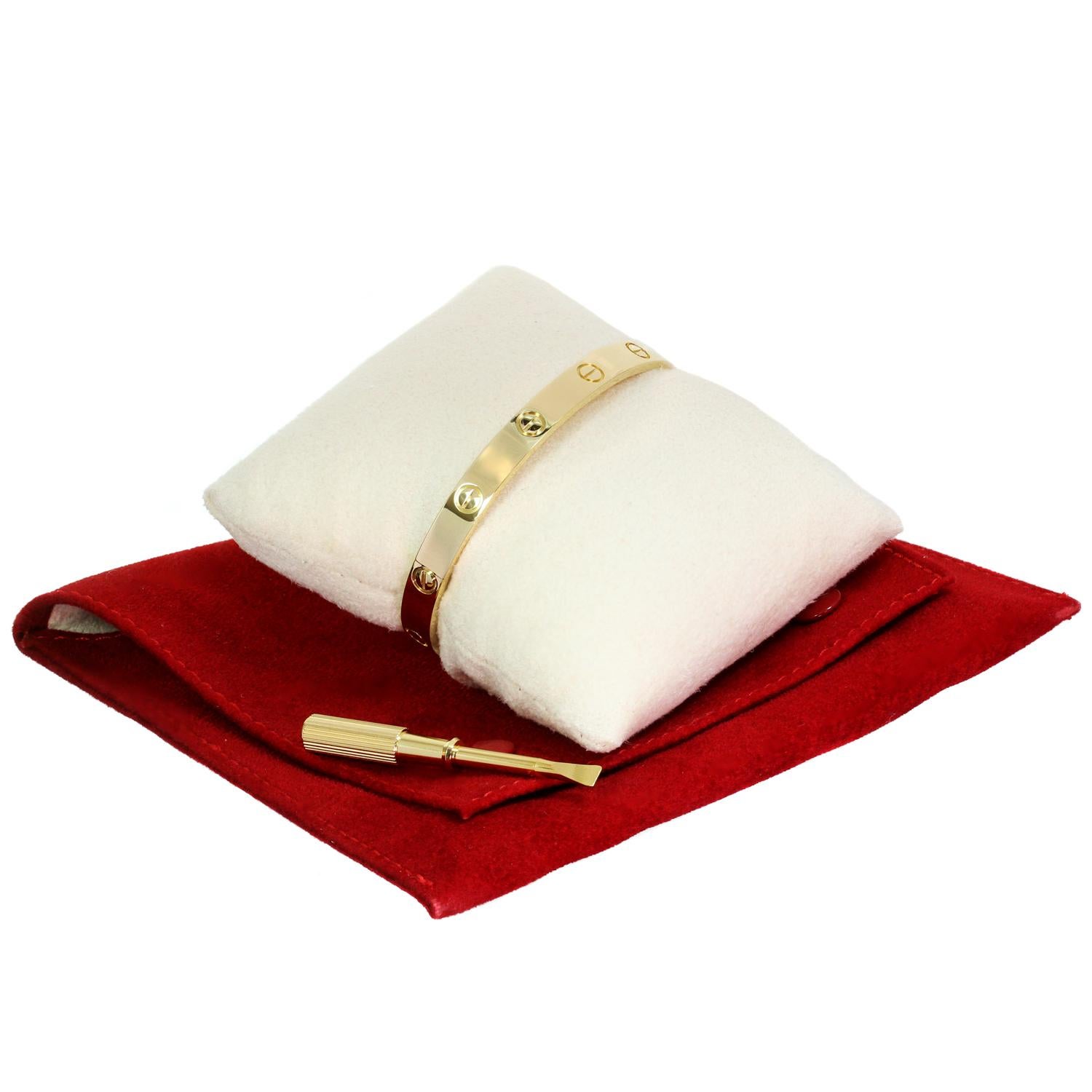This classic Cartier bangle from the iconic Love collection is crafted in 18k white gold and comes with the original screwdriver and box. This bracelet is a size 18. Made in France circa 2010s. Excellent condition. Comes with original pouch and