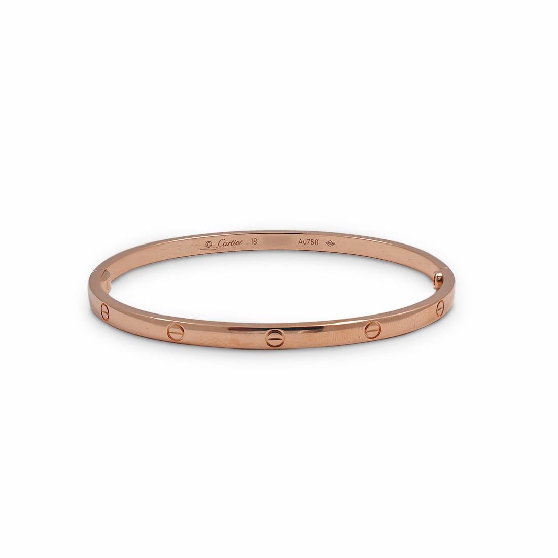 Authentic Cartier 'Love' bracelet crafted in 18 karat rose gold. Size 18. Signed Cartier, 18, Au750, with serial number and hallmarks. The bracelet is presented with a Cartier pouch, service papers, and screwdriver. CIRCA 2010s.

Brand: Cartier