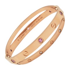 Bracelet 'Love' de Cartier en or rose:: diamants et saphirs roses