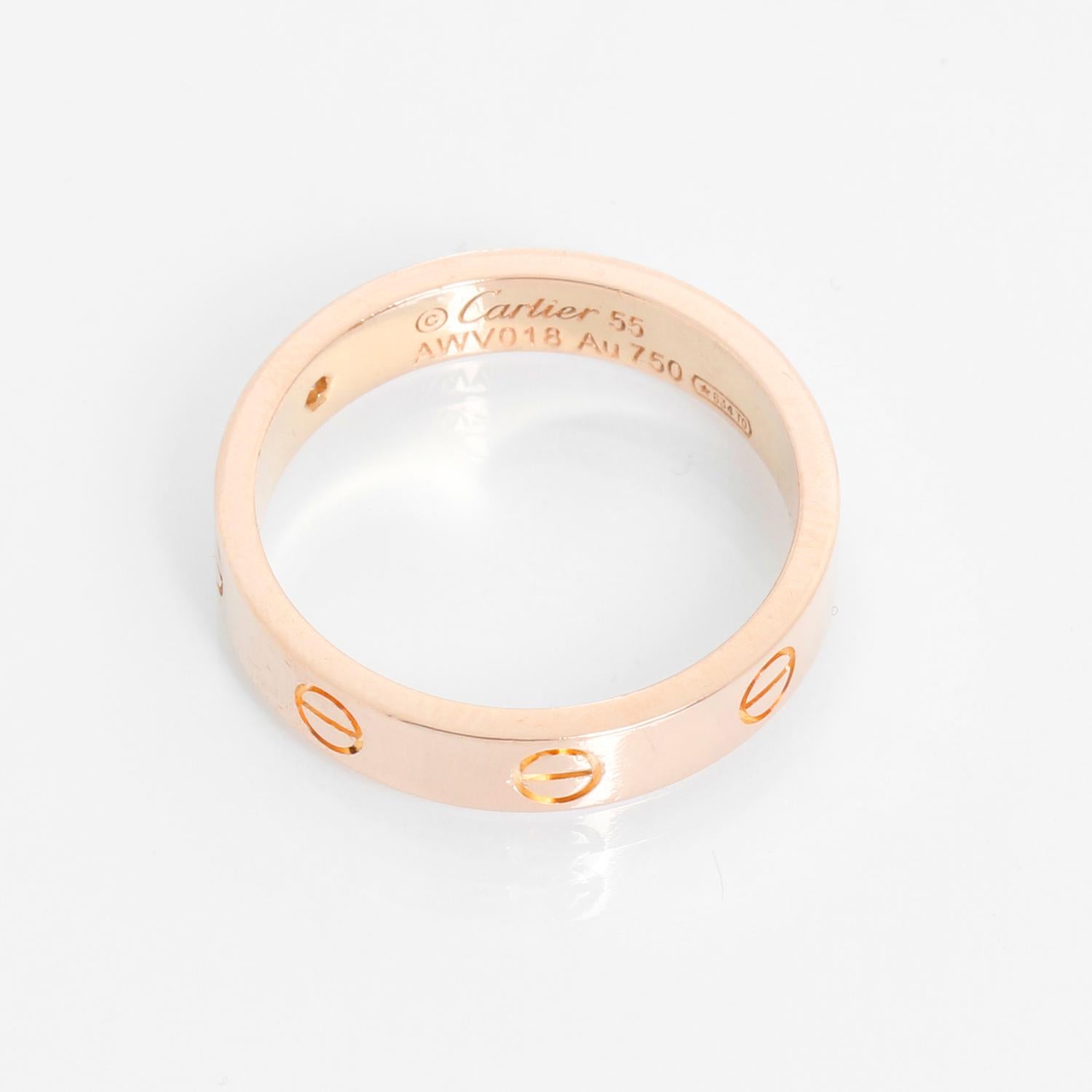 Cartier Love Small 1 Diamond Rose Gold Wedding Band Size 7 1/4 - Cartier Love Wedding Band. 18K Rose gold Wedding band set with 1 brilliant cut diamond totaling .02 carats. Width 4 mm. Size 55. Pre-owned. Hallmarked.