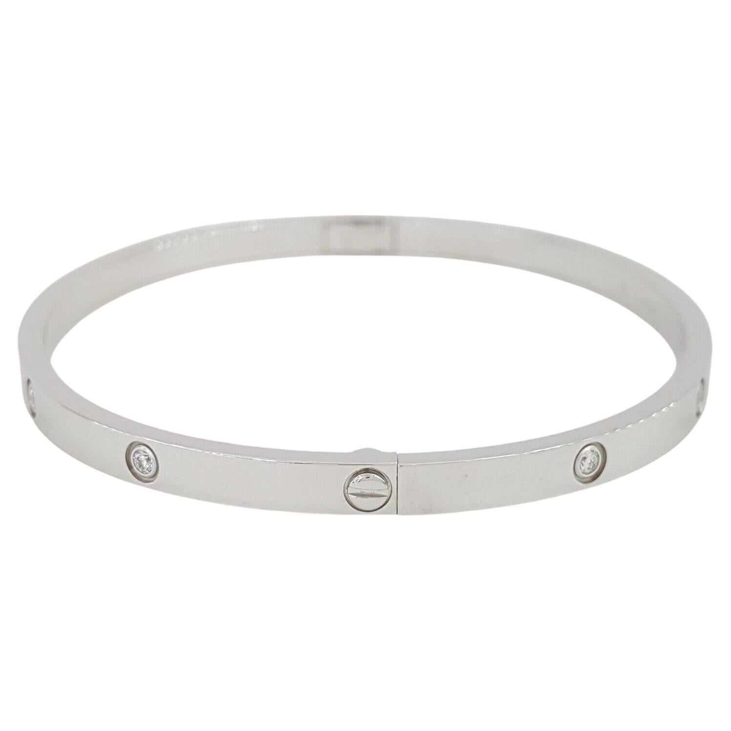 Cartier Love Small 18K White Gold 0.21 ct Round Brilliant Cut 10 Diamond Bracelet 3.7mm Wide Size 18.



The Bracelet weighs 21.4 grams of solid 18K White Gold, 3.7 mm wide, Size 18, 59.5x50mm inner Diameter, there are 10 natural round diamonds