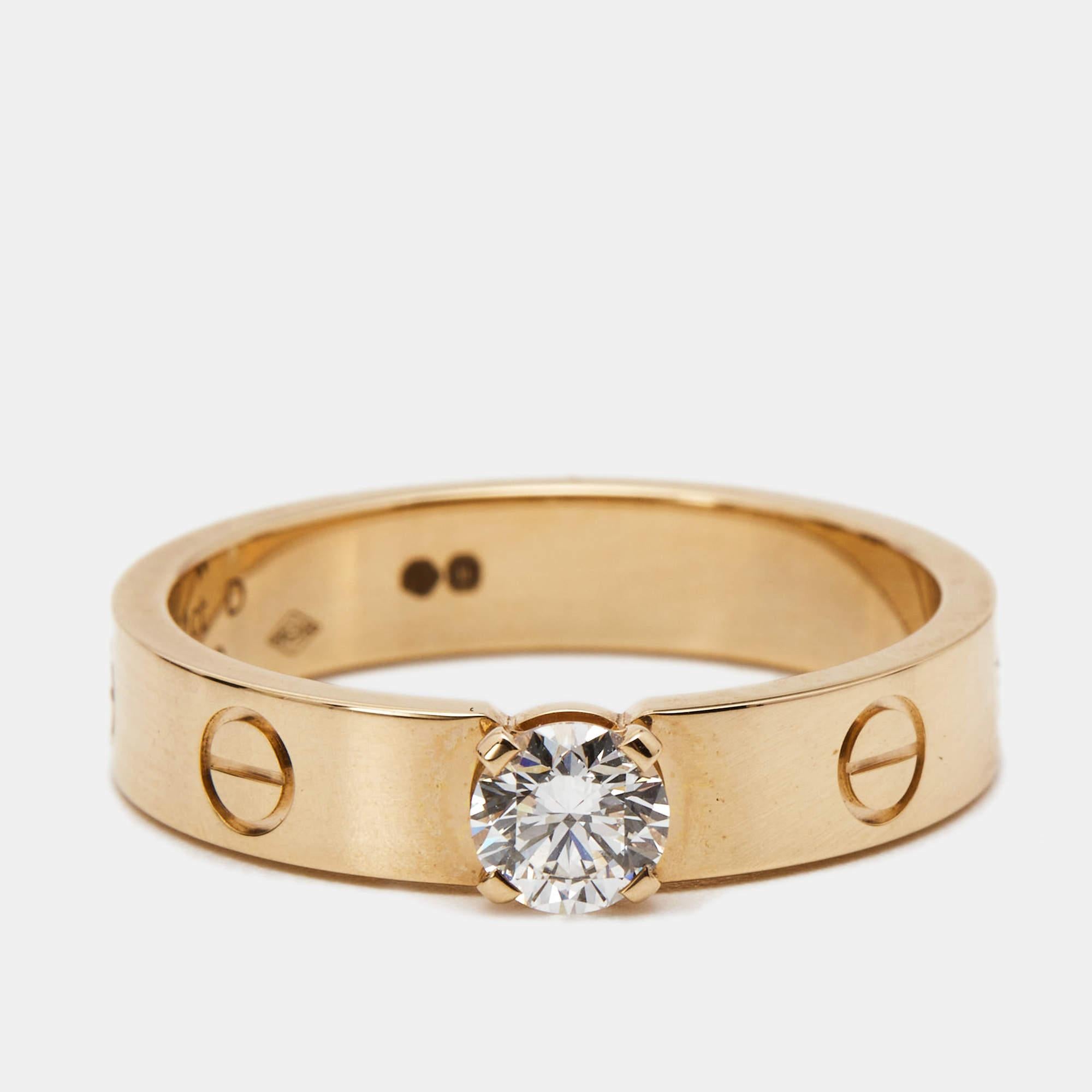 The Cartier Love ring is an exquisite and timeless piece of jewelry. Crafted from luxurious 18k rose gold, the ring features a dazzling solitaire diamond at its center, elegantly secured by the iconic Cartier Love motif. The combination of the 18k