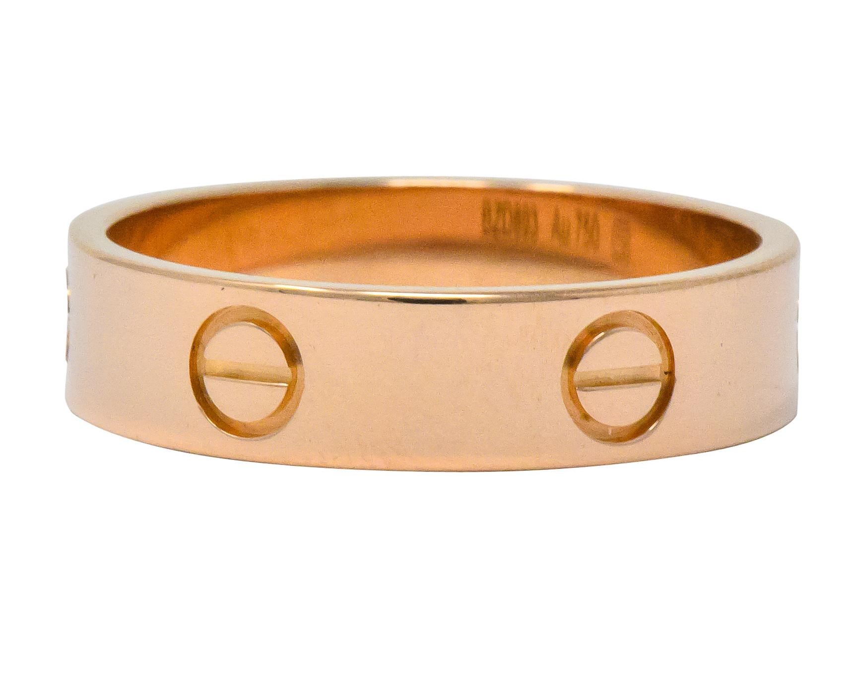 Rose gold band ring featuring screw head motif

From Cartier's Love collection

Fully signed Cartier and numbered

Stamped 750 for 18 karat gold and 62

Ring Size: 10 & not sizable

Measures: 5.4 mm and sits 1.4 mm high

Total weight: 6.6