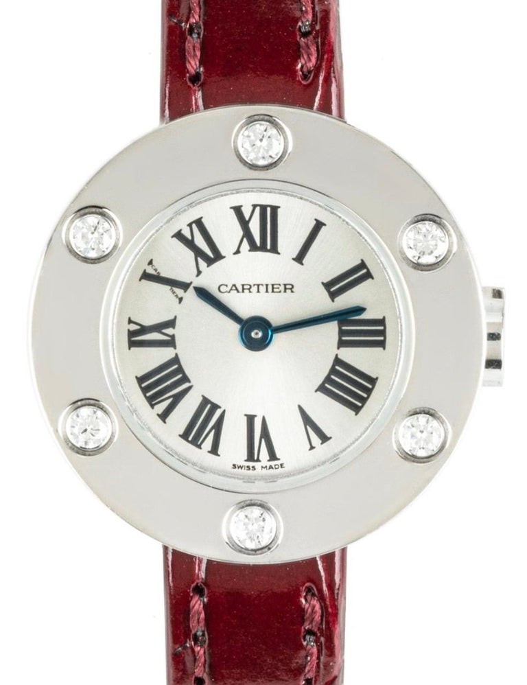 A ladies 23mm Cartier Love watch crafted in white gold. Features a silver dial with roman numerals, a hidden Cartier signature at 
