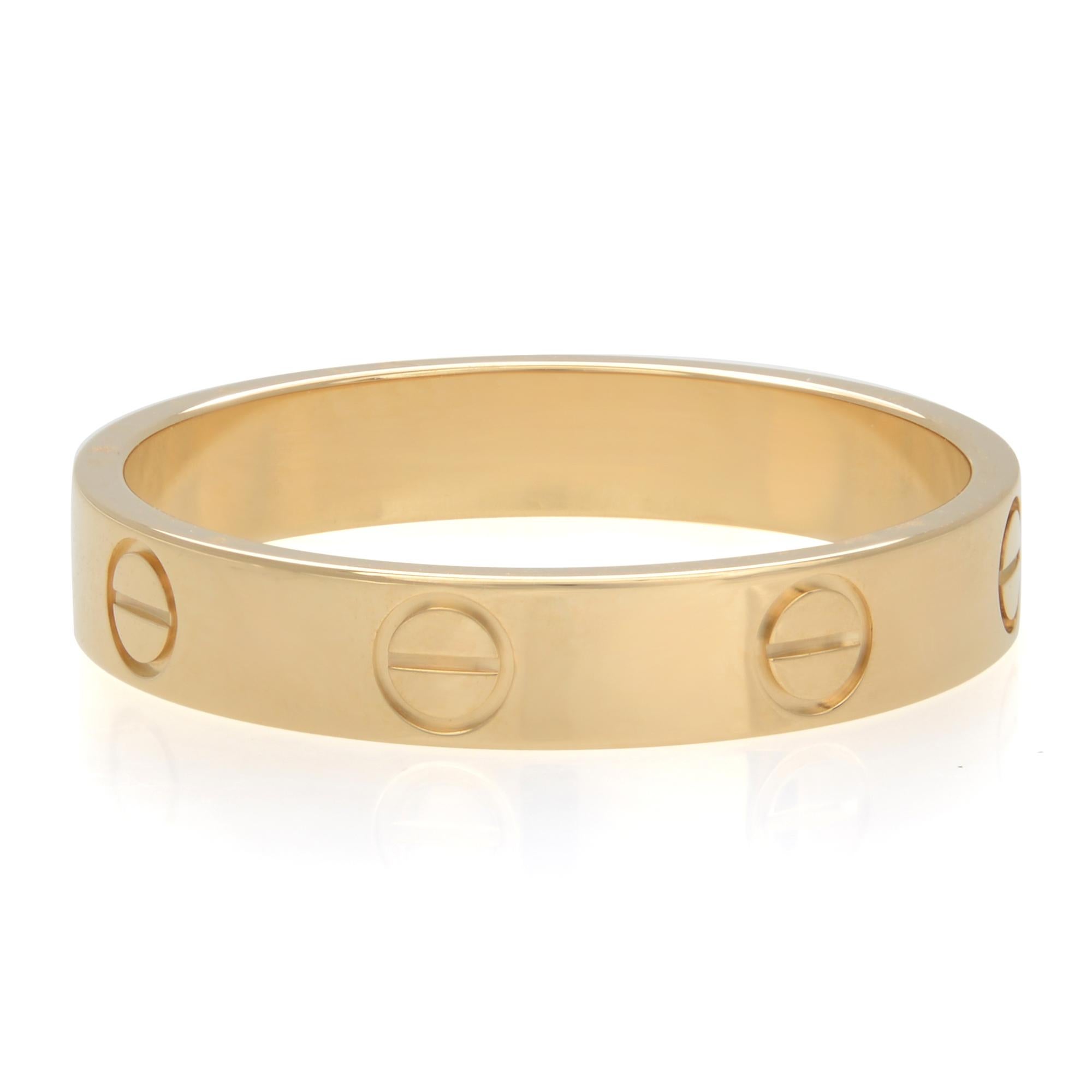 Cartier Love wedding band in 18K yellow gold. Small model Love ring. Width: 3.6mm. Ring size 56 US 9.75. Excellent pre-owned condition. Comes with box and papers. 