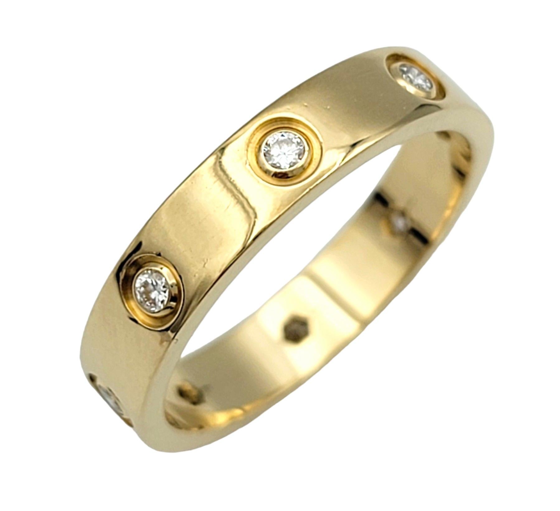 Ring Size: 6.75

This beautiful Cartier Love band ring with diamonds is an iconic symbol of enduring love and timeless elegance. Crafted by the renowned luxury brand Cartier, this ring embodies sophistication and luxury in every detail. The band