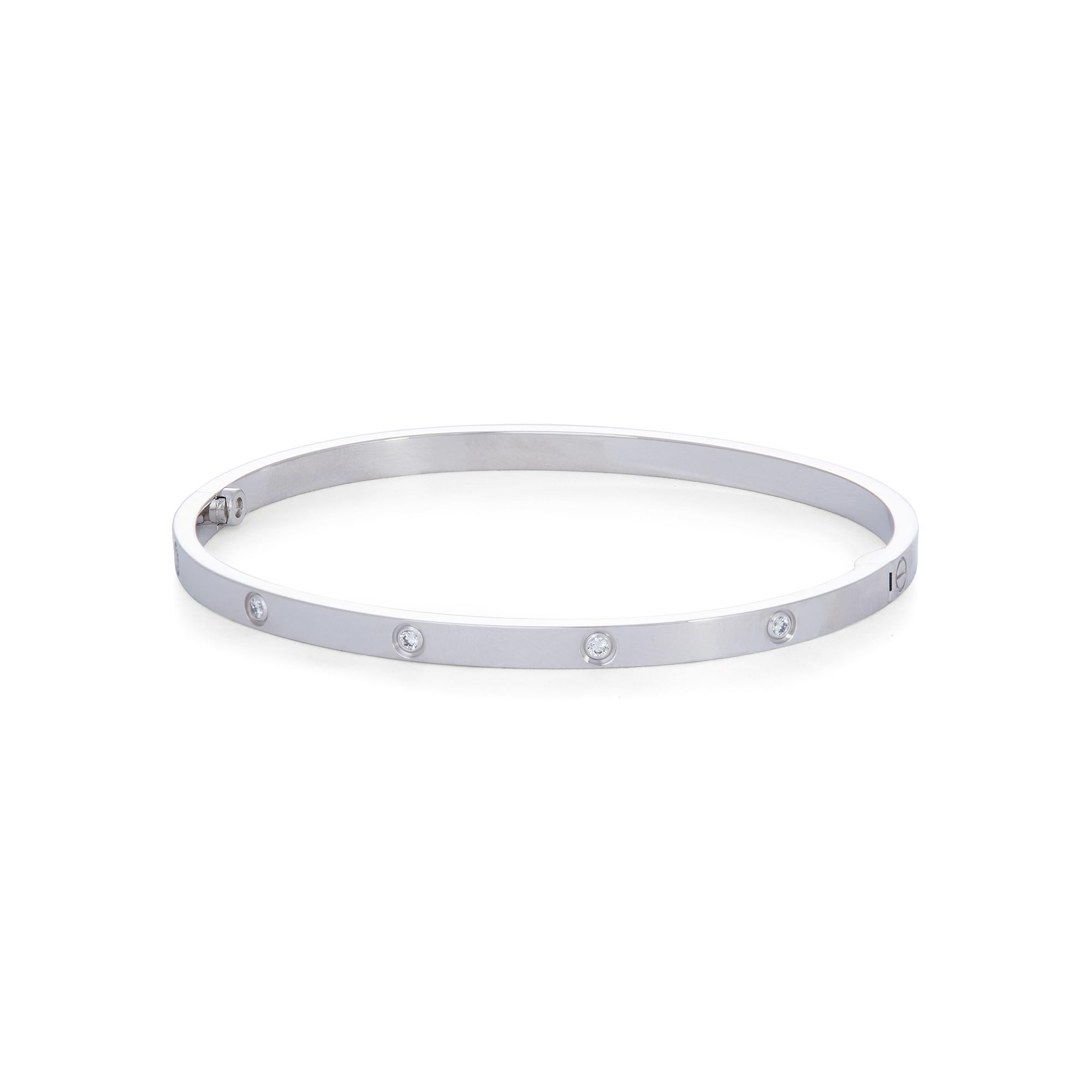 Authentic Cartier 'Love' bracelet crafted in 18 karat white gold is set with ten round brilliant cut diamonds (E-F, VS) weighing 0.21 carats total. Size 18.  Signed Cartier, Au750, 18, with serial number and hallmark. The bracelet is presented with