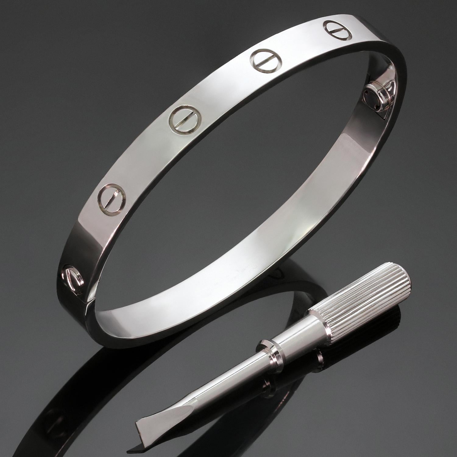 This classic Cartier bangle from the iconic Love collection is crafted in 18k white gold and completed with the original screwdriver. This bracelet is a size 17.  Made in France circa 2013. Measurements: 0.23