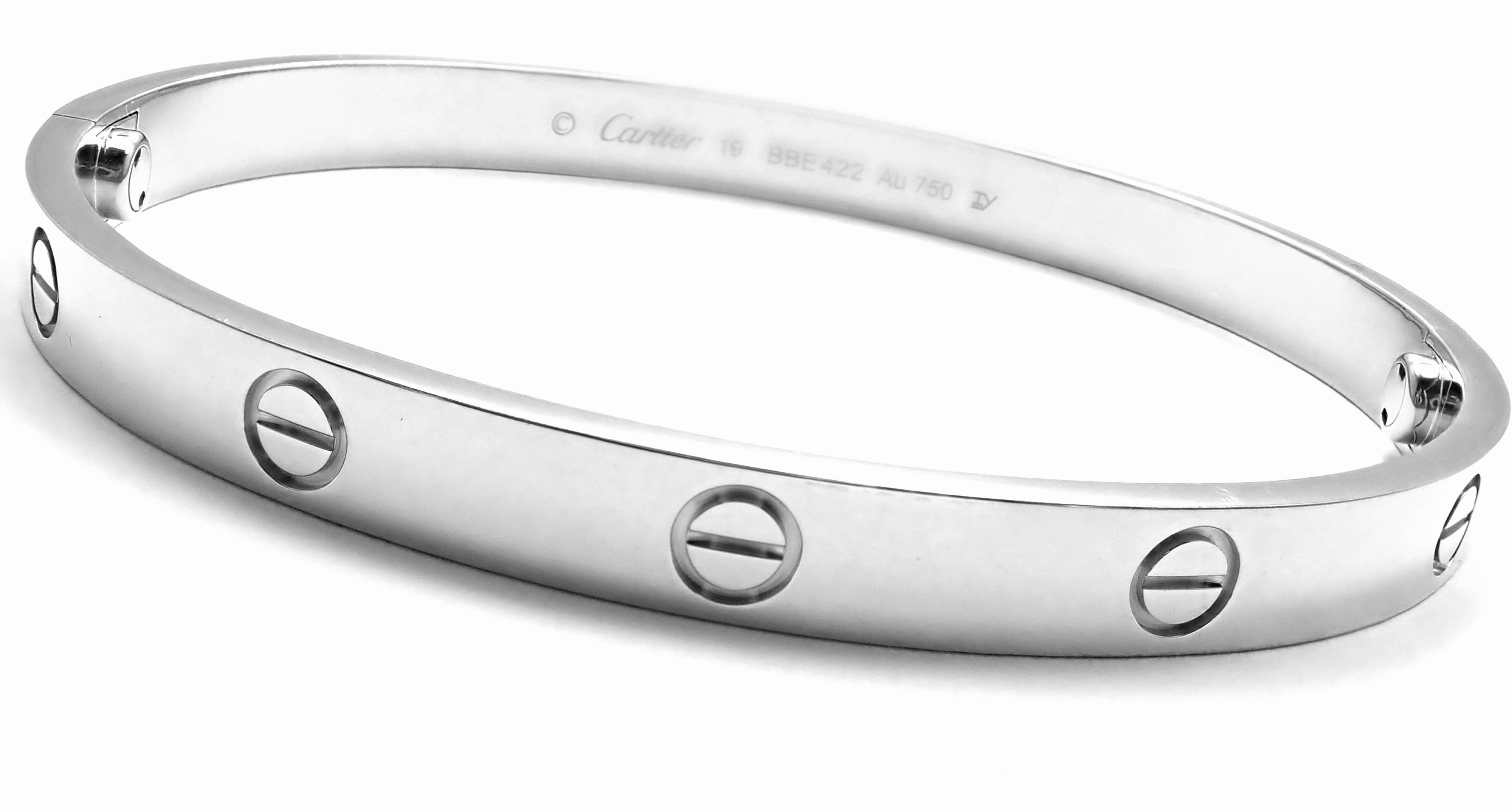 18k White Gold Love Bangle Bracelet by Cartier. Size 19. 
This bracelet comes with Cartier certificate, Cartier box and Cartier screwdriver.
This bracelet has the new screw system.
Details: Size: 19 
Weight: 38.1 grams
Width: 6.5mm 
Hallmarks: