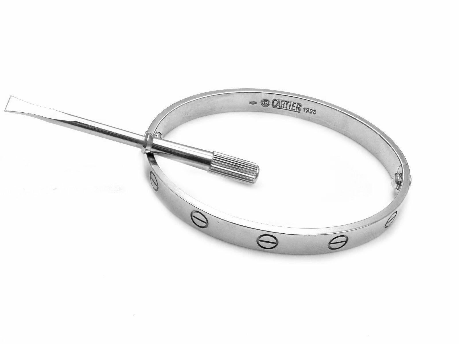 18k White Gold Love Bangle Bracelet by Cartier. Size 17. 
This bracelet comes with Cartier certificate, Cartier box and Cartier screwdriver.
Details: Size: 17 
Weight: 33.2 grams
Width: 6.5mm 
Hallmarks: Cartier 750 17 1993 135860
*Free Shipping