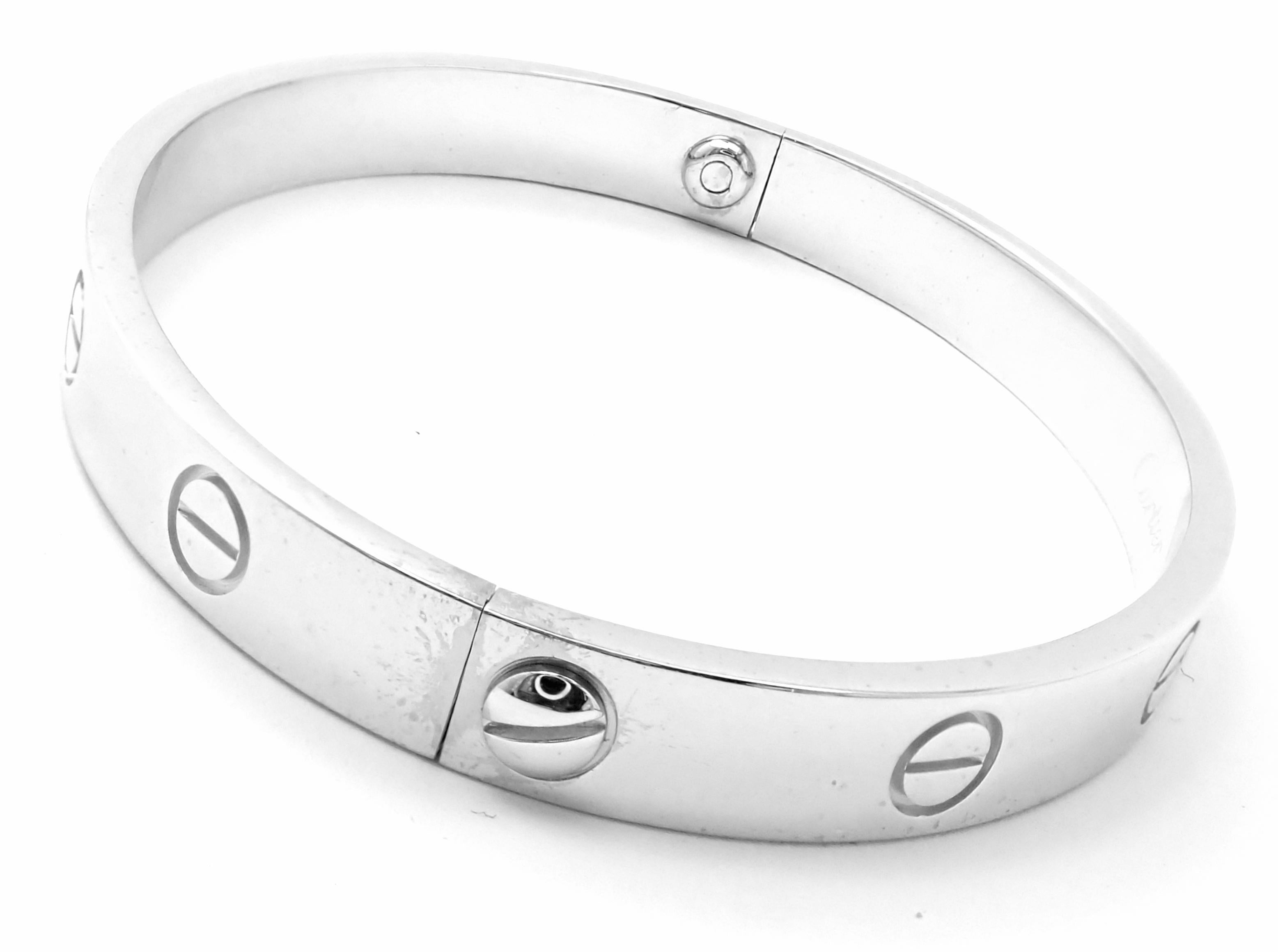 18k White Gold Love Bangle Bracelet by Cartier. Size 17. 
This bracelet comes with Cartier box and Cartier screwdriver.
Details: Size: 17 
Weight: 34.1 grams
Width: 6.5mm 
Hallmarks: Cartier 750 17 1993 K8XXXX(serial number omitted)
*Free Shipping