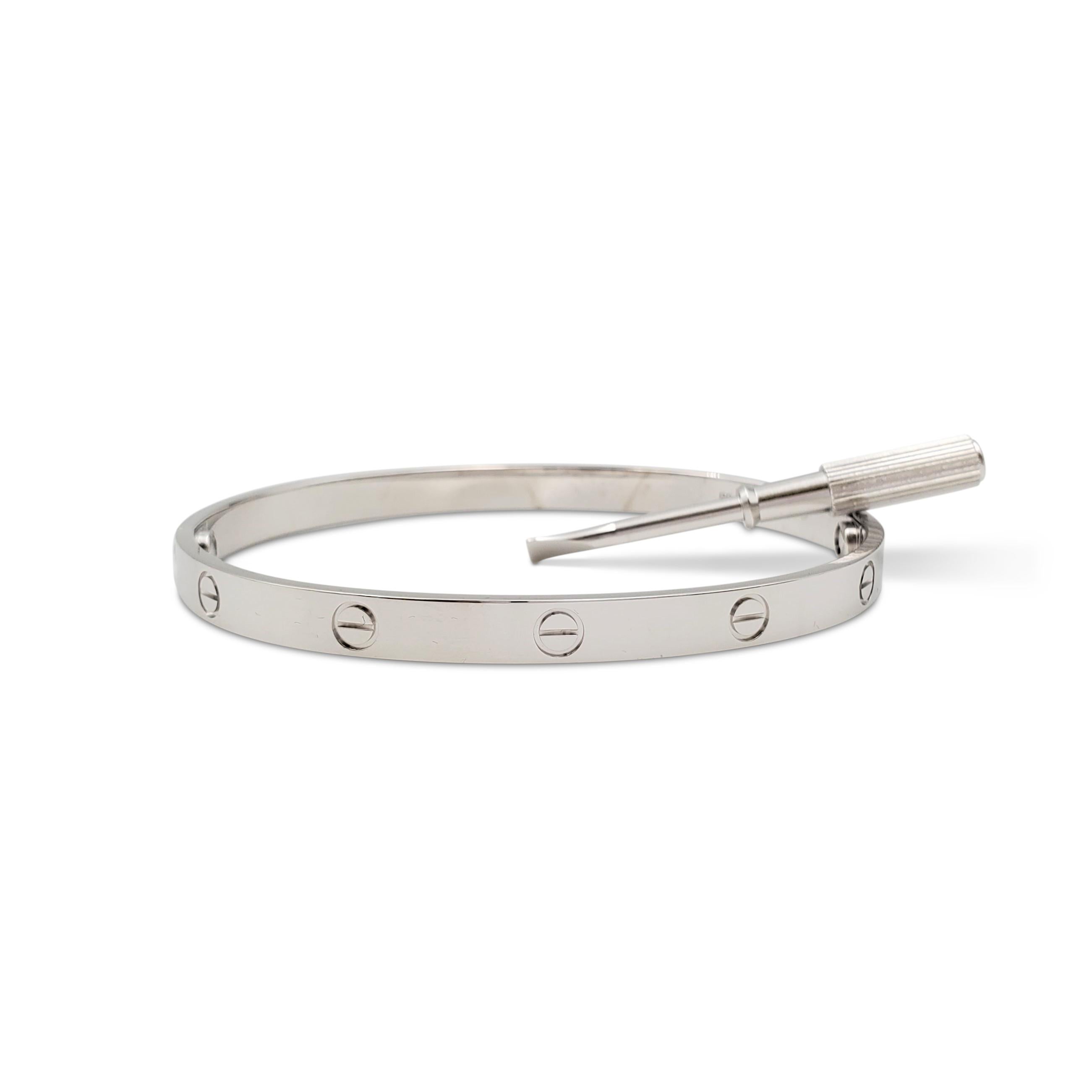 Authentic Cartier 'Love' bracelet crafted in 18 karat white gold. Size 21. Signed Cartier, 17, Au750, with serial number and hallmarks. The bracelet is presented with the pouch and screwdriver. Not presented with the original Cartier box or papers.