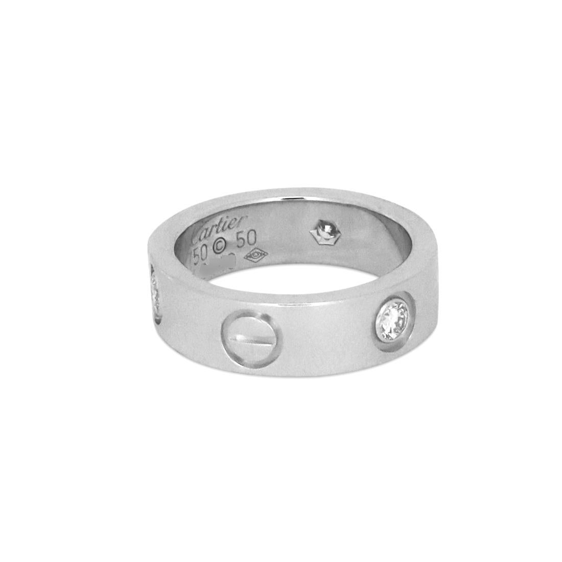 Authentic Cartier 'Love' ring crafted in 18 karat white gold and set with three round brilliant cut diamonds (G, VS) weighing an estimated 0.22 carats total weight. Ring size 50 (US 5 1/4). Signed Cartier, 750, 50, with serial number. The ring is