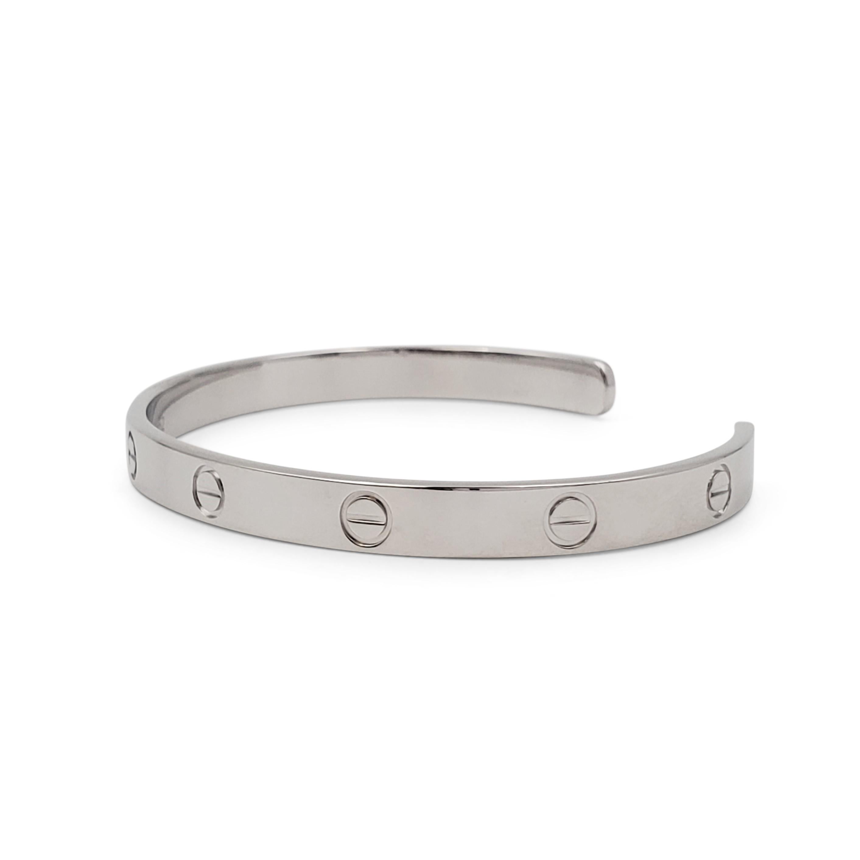 Authentic Cartier 'Love' open cuff bracelet crafted in 18 karat white gold. Signed Cartier, 750, 20, with serial number and hallmarks. The bracelet is not presented with the original box or papers. CIRCA 2010s.

Bracelet Size: 20 (20 cm)
Box: