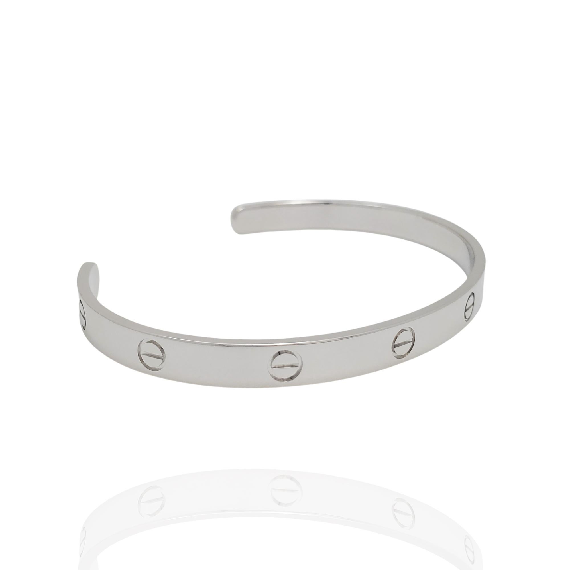 Authentic Cartier 'Love' open cuff bracelet crafted in 18 karat white gold. Signed Cartier, 750, 21, with serial number and hallmarks. The bracelet is presented with the original box and papers. CIRCA 2000s.

Brand: Cartier
Collection: Love
Metal: