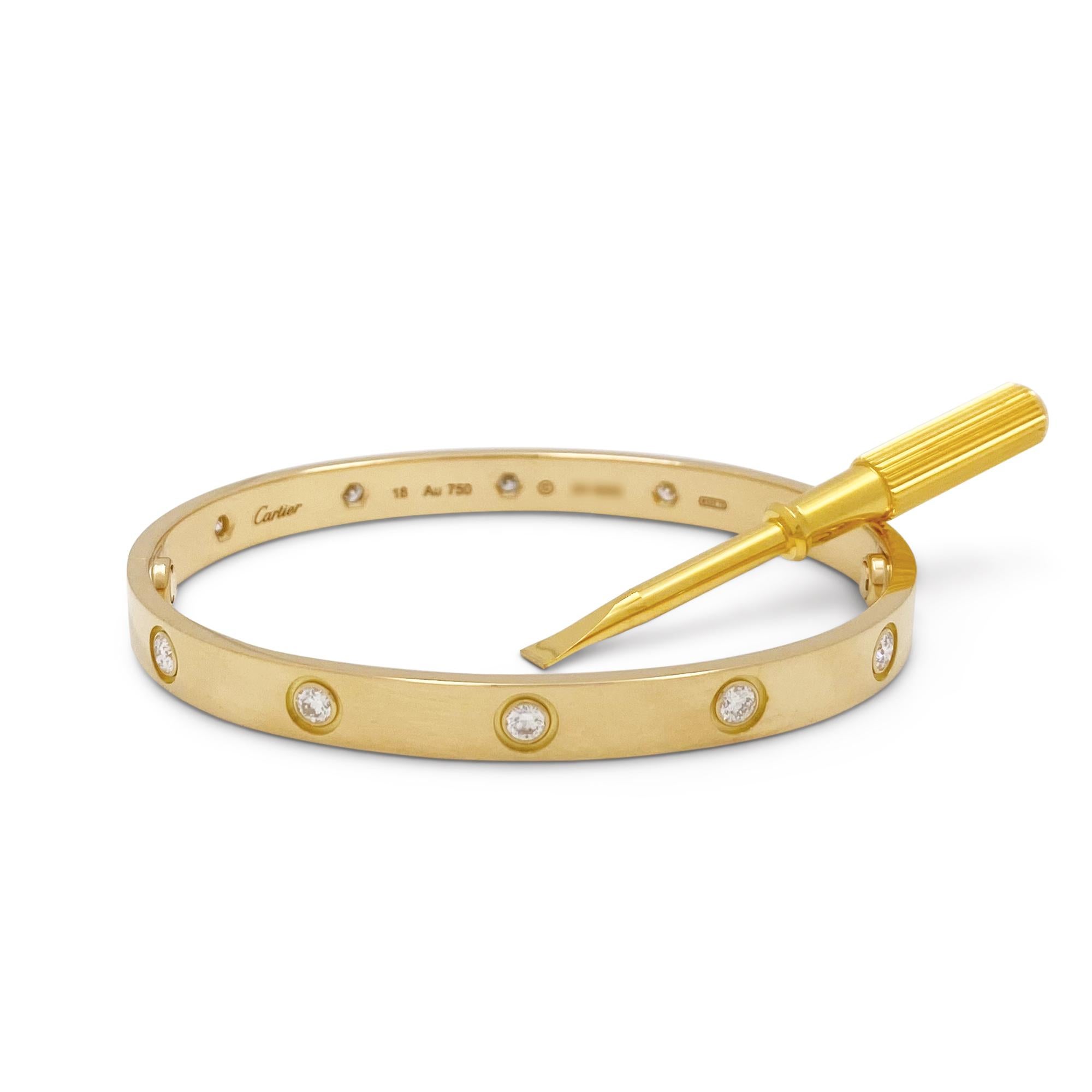Authentic Cartier 'Love' bracelet crafted in 18 karat yellow gold is set with ten round brilliant cut diamonds (E-F, VS) weighing 0.42 carats total. Size18.  Signed Cartier, Au750, 18, with serial number and hallmark. The bracelet is presented with