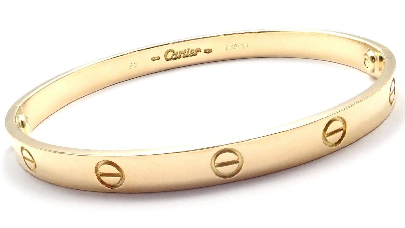 18k Yellow Gold Love Bangle Bracelet by Cartier Size 20.
This bracelet comes with Cartier service paper, box and screwdriver.
Details: 
Size: 20
Weight: 36.7 grams
Width: 6.5mm 
Hallmarks: Cartier 750 20 E39291
*Free Shipping within the United