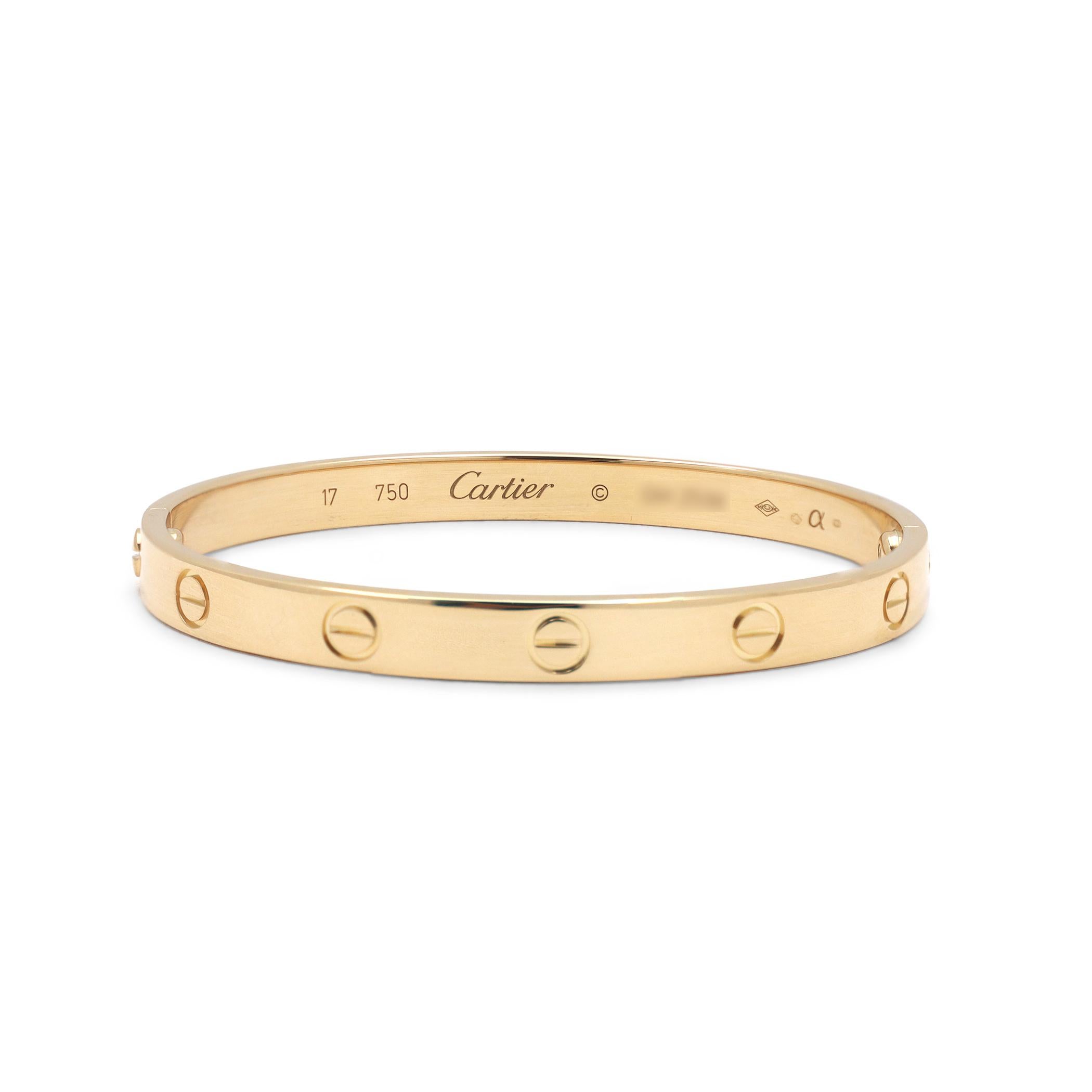 Authentic Cartier 'Love' bracelet crafted in 18 karat yellow gold. Size 17. Signed Cartier, 17, Au750, with serial number and hallmarks. The bracelet is presented with the original box, papers and screwdriver. CIRCA 2000s.

Original Box: