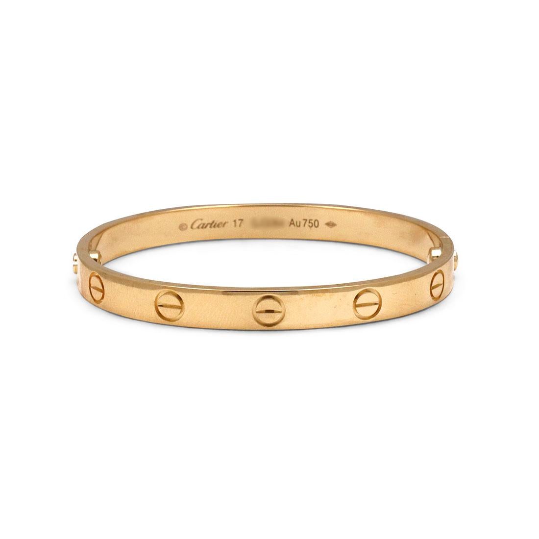 Authentic Cartier 'Love' bracelet crafted in 18 karat yellow gold. Size 17. Signed Cartier, 17, Au750, with serial number and hallmarks. The bracelet is presented with the original screwdriver, papers, and no box. CIRCA 2010s.

Brand: