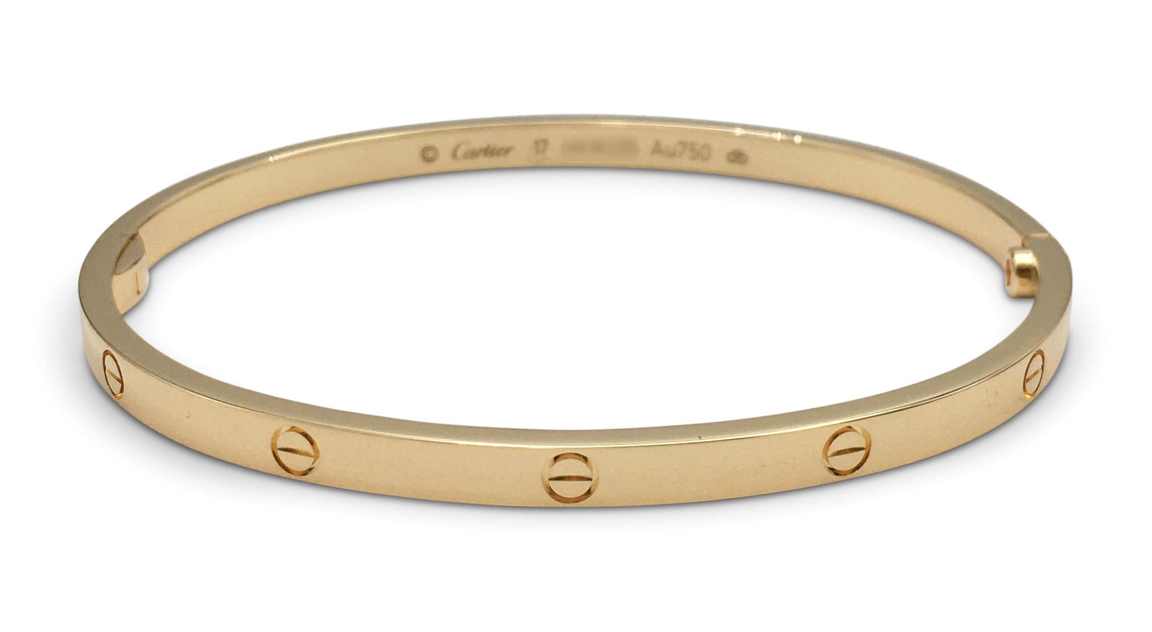 Authentic Cartier 'Love' bracelet crafted in 18 karat yellow gold. Size 17. Signed Cartier, Au750, with serial numbers. The bracelet is presented with the original screwdriver, Cartier papers, and box. CIRCA 2010s.