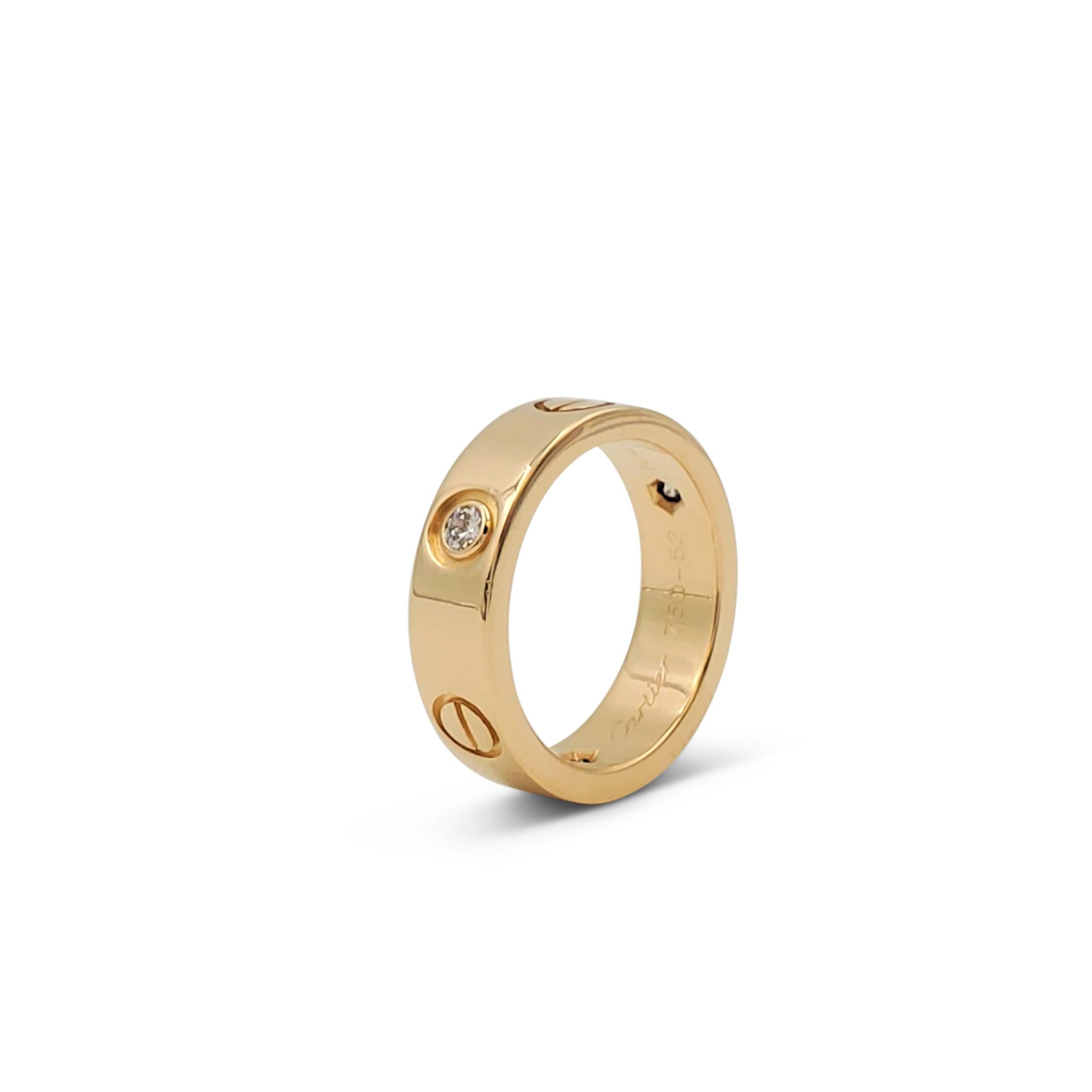 Authentic Cartier 'Love' ring crafted in 18 karat yellow gold and set with three round brilliant cut diamonds. Signed Cartier, 750, 52, 1998, with serial number and hallmarks. Ring size 52 (US 6). The ring is not presented with the original box or
