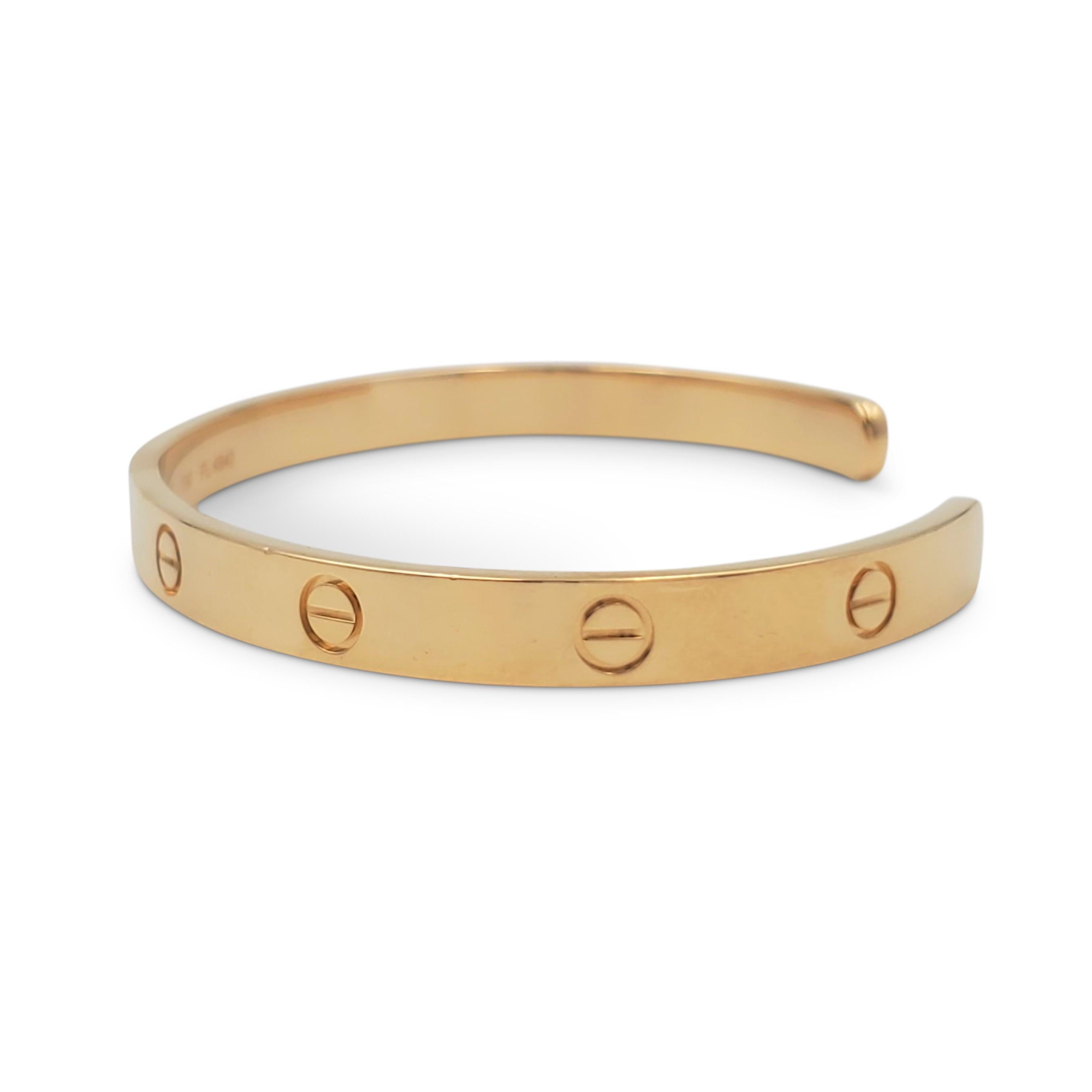 Authentic Cartier 'Love' open cuff bracelet crafted in 18 karat yellow gold. Signed Cartier, 750, 20, with serial number and hallmarks. The bracelet is not presented with the original box or papers. CIRCA 2010s.

Bracelet Size: 20 (20 cm)
Box: