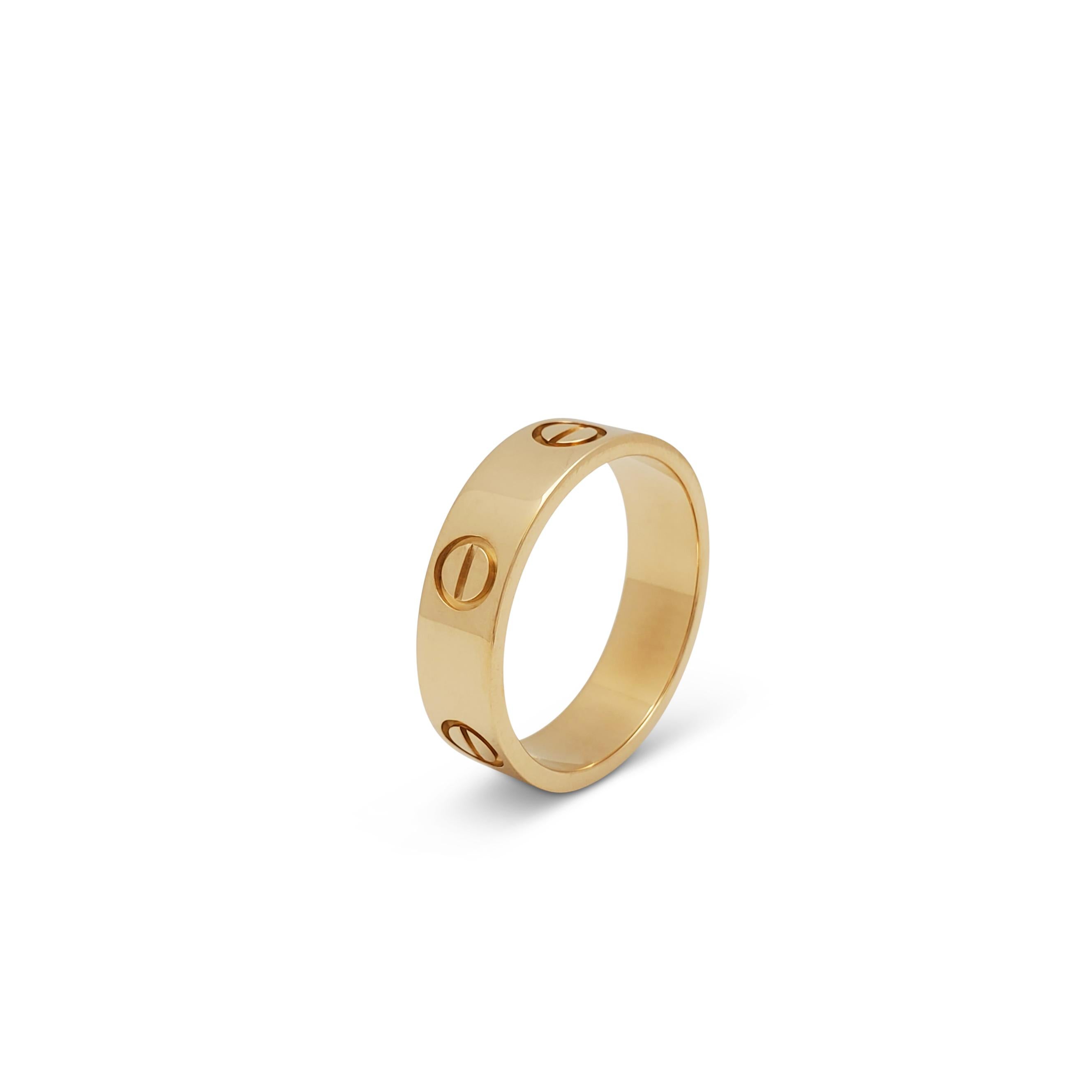 Authentic Cartier 'Love' ring crafted in 18 karat yellow gold. Signed Cartier, Au750, 56, with serial number and hallmarks. US ring size 7.5. The ring is presented with the original box and papers. CIRCA 2010s.

Brand: Cartier
Collection: